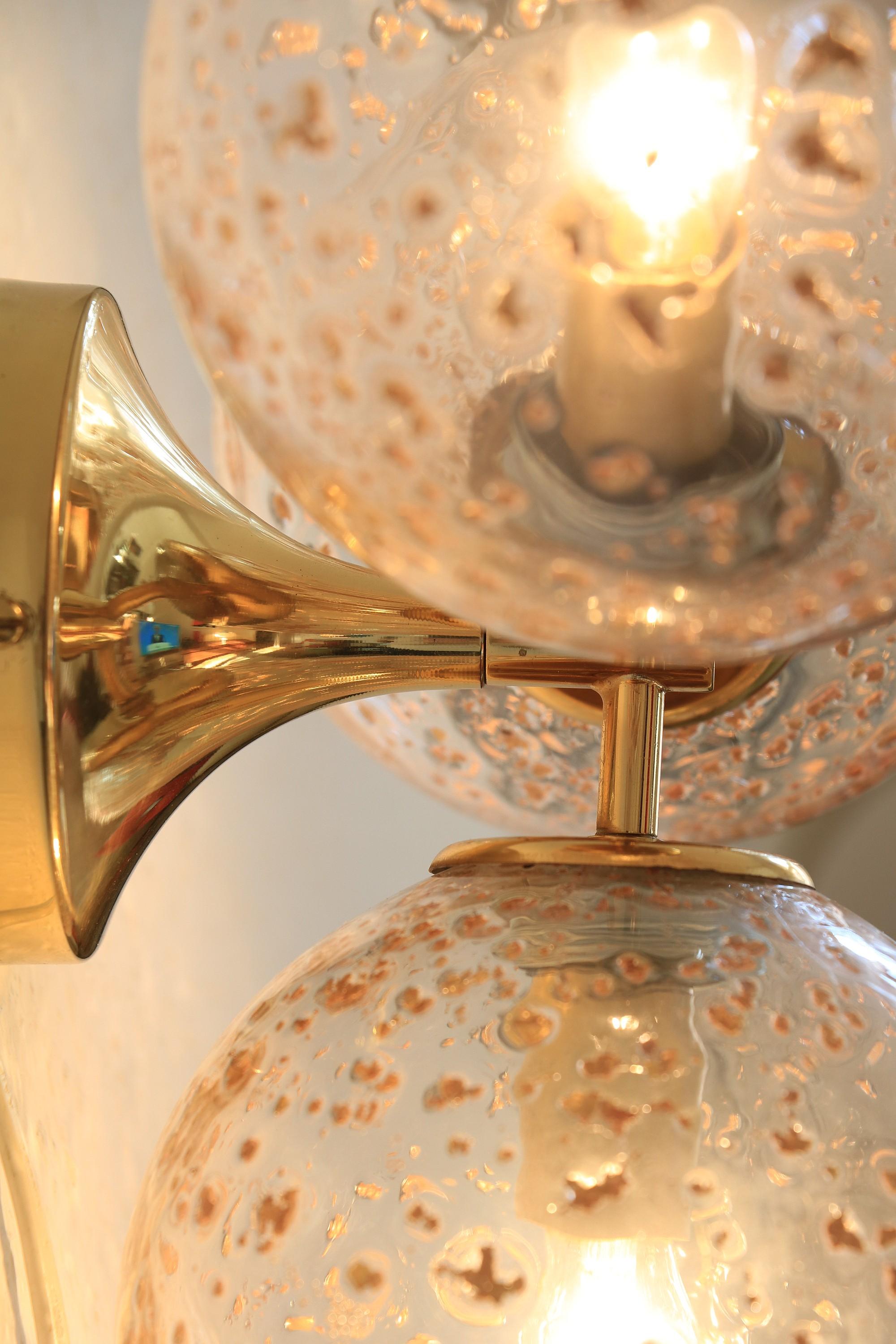 Sputnik wall or ceiling lamp with three glass balls and gold inclusions.
The glass is high quality and mouthblown.
 
Manufacturer: Temde, Switzerland
 
Diameter total: 35 cm / 13.77 inches
Diameter ball: 15 cm / 5.9 inches
Depth: 18 cm / 7.08