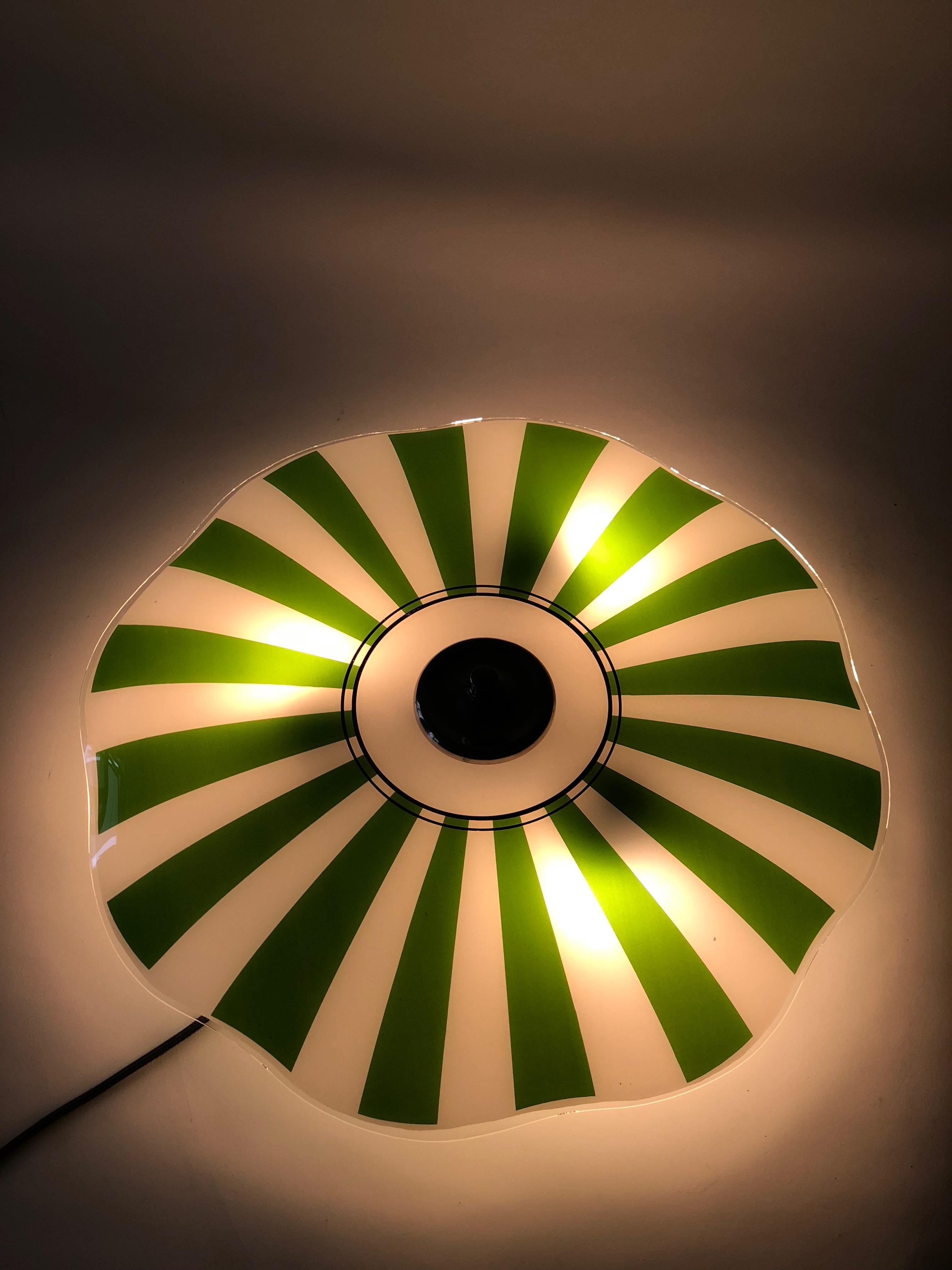 Glass wall lamp from designfornication. This is our own design based on a vintage glass plate, that was produced in Czechoslovakia in 1956.
The light produced, makes a beautiful atmosphere enhancing your living environment. If you choose to use the