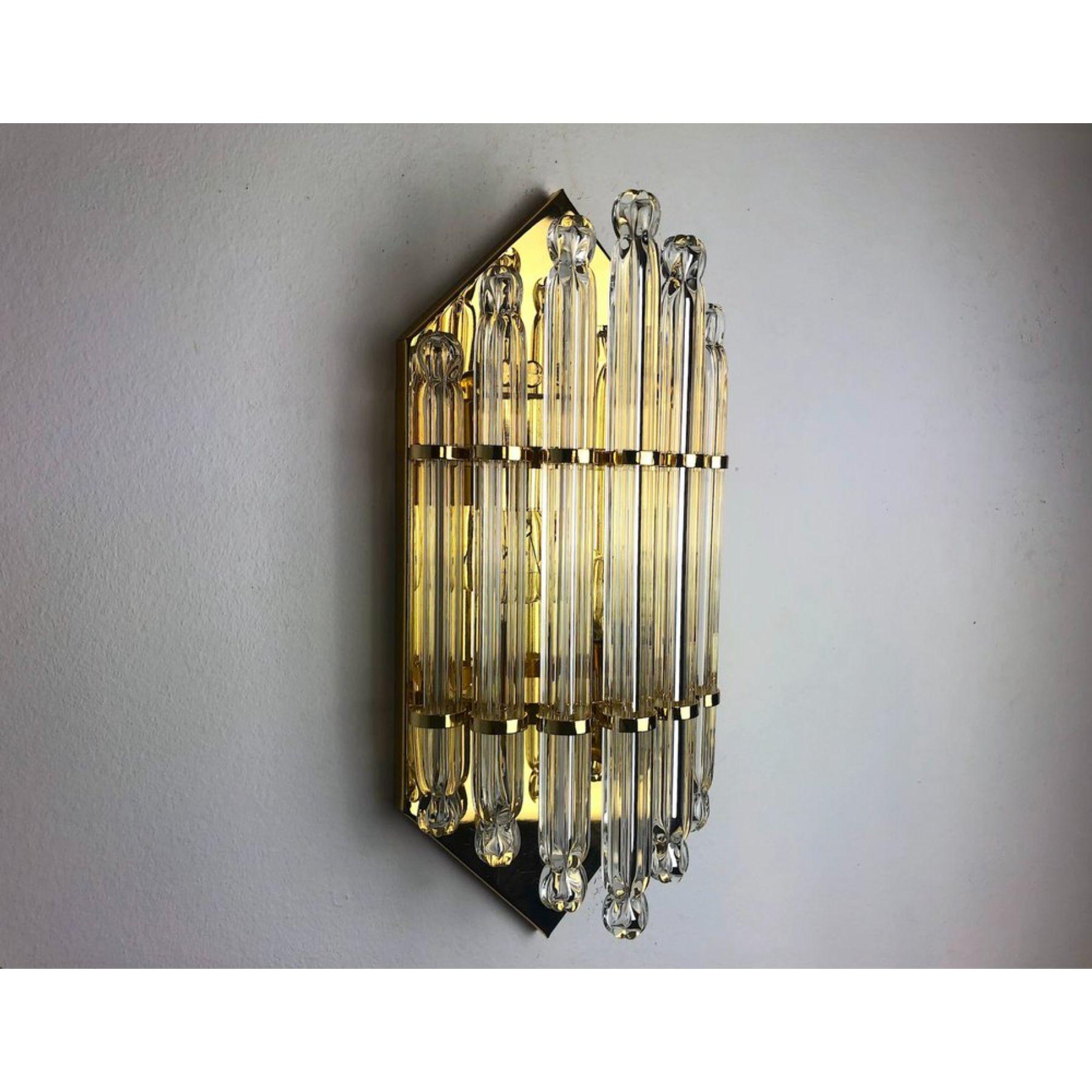 Very beautiful glass wall lamp dating from the 70s, italy. Cut glass and gilded metal structure. Unique object that will illuminate and bring a real design touch to your interior. Verified electricity, time mark relating to the age of the object,
