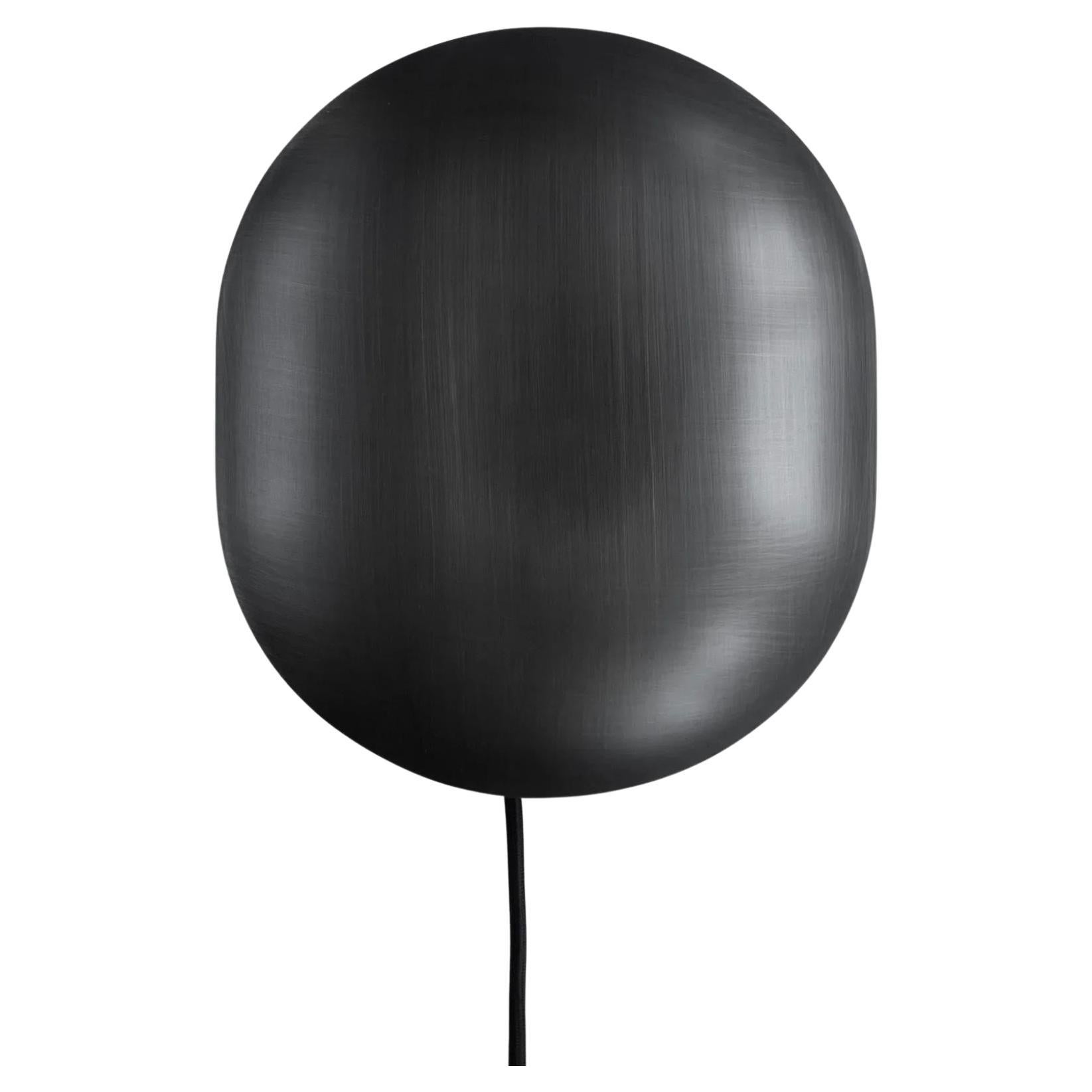 Aplique de pared, de metal color bronce, pieza contemporánea.