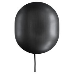 Aplique de pared, de metal color bronce, pieza contemporánea.