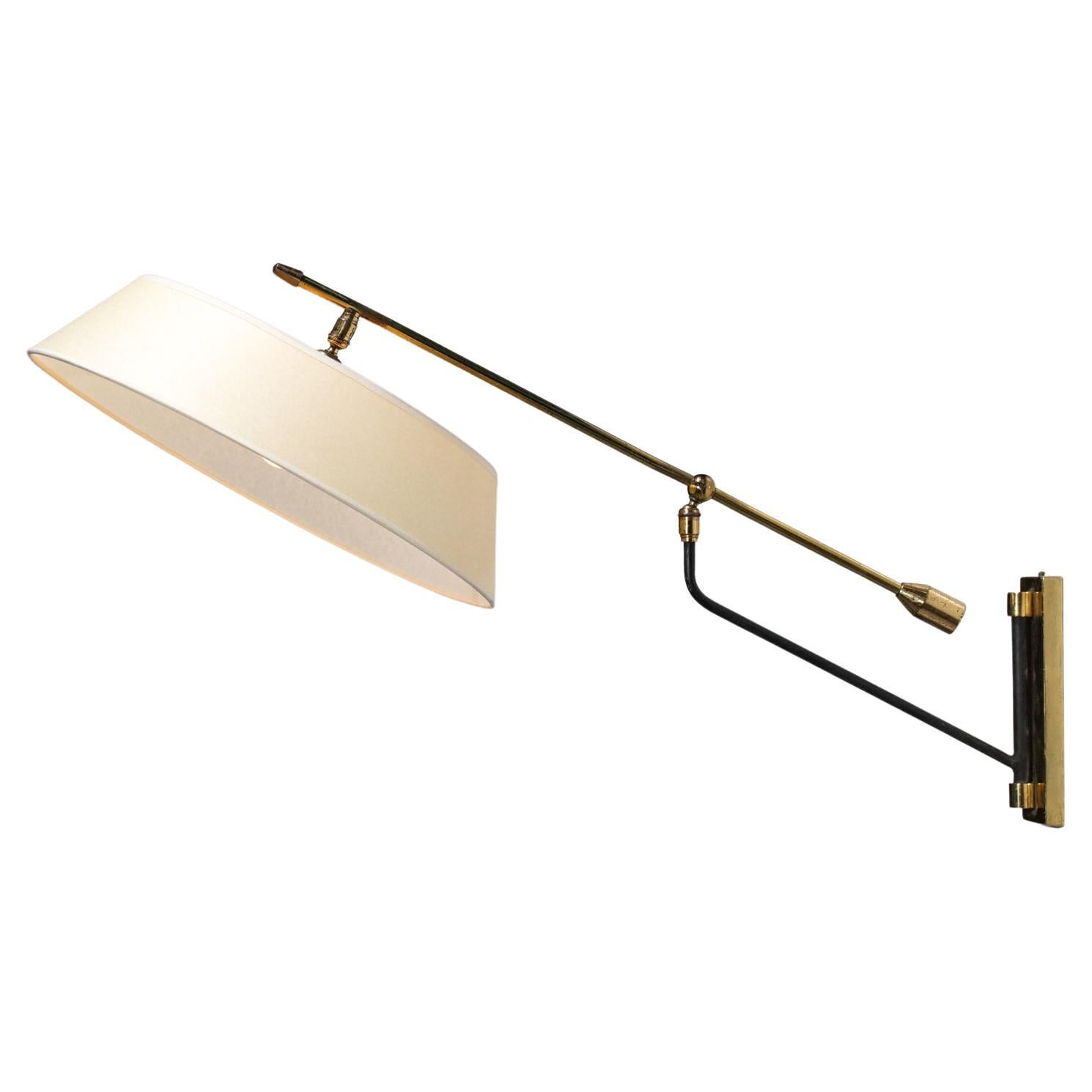 Beautiful wall lamp from the 50's edited by the Maison Arlus. Arm and counterweight in solid brass and black lacquered metal, fabric shade made to measure. Possibility to orientate the arm and the shade thanks to two ball joints. Very nice vintage