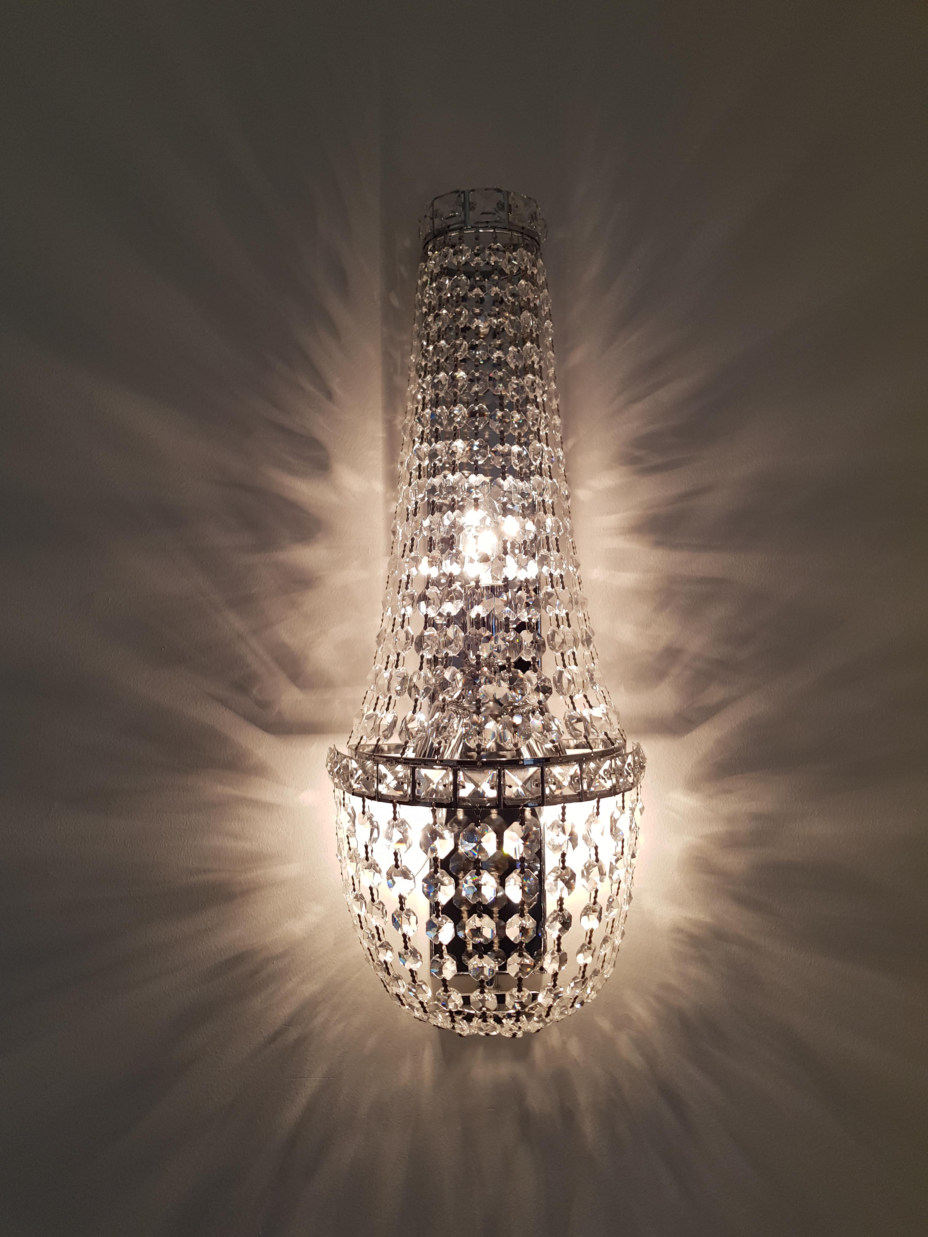 New modern crystal wall light. Lead crystal. House production.

Measures: Diameter 22 cm 
High 55 cm
3 x E14 bulbs.

Also possible . . .
- Production according to mass possible. 
- Available in several sizes.

Wall light sconces modern