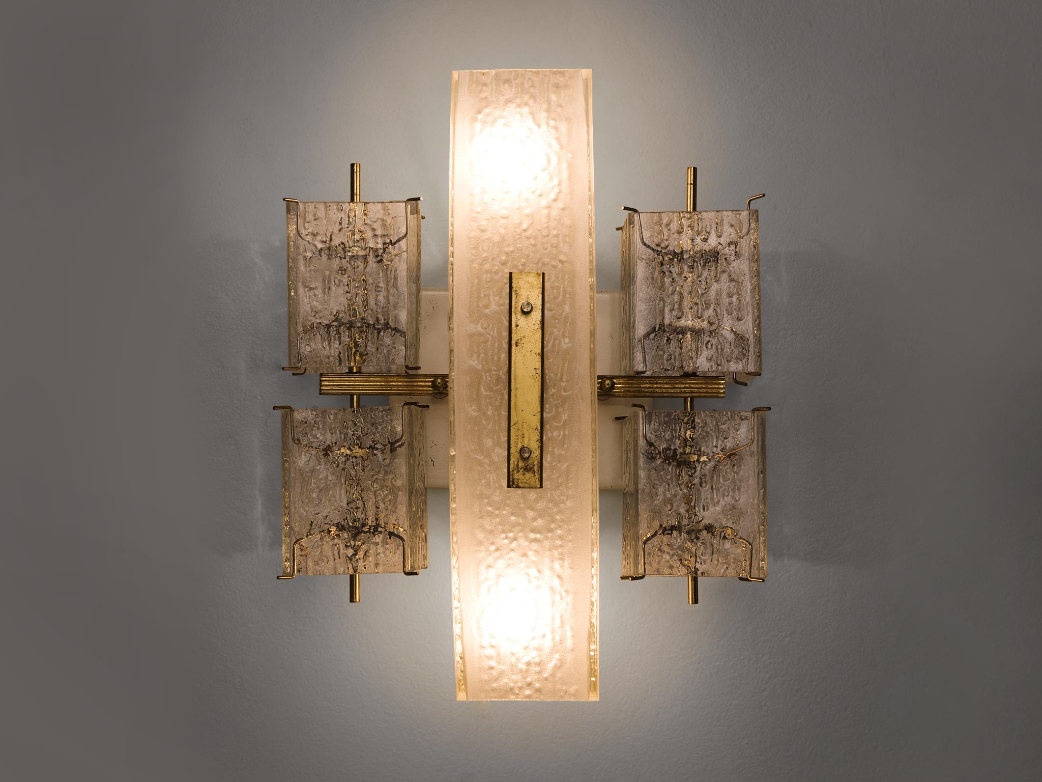Wall light, in glass and brass, Europe, 1970s. 

This elegant square wall light features four small rectangular structured glass shades and a rectangular opaque middle section. The frame is made of brass and holds small brass pins on which the