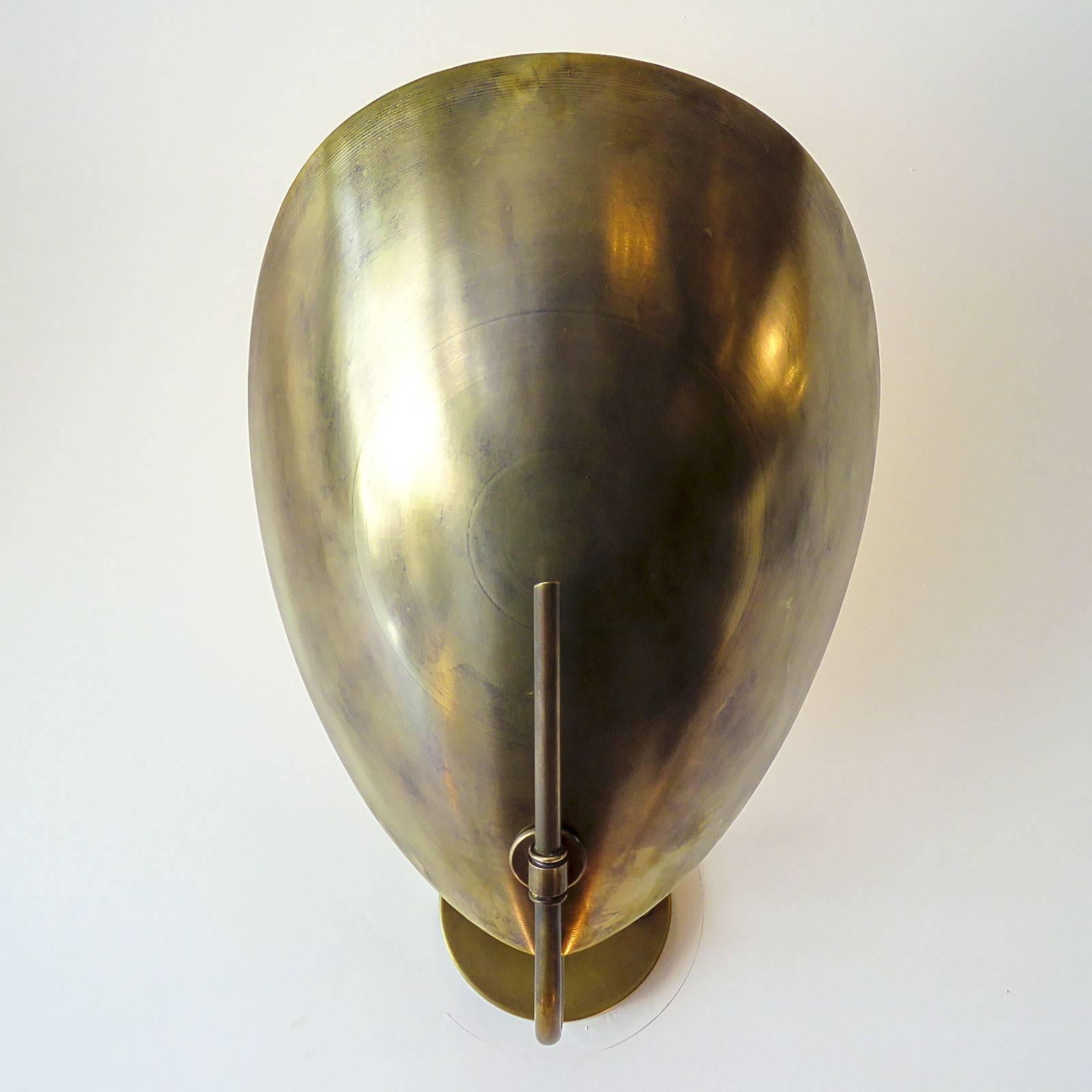 Great brass sconces, reminiscent of beetle armor, also available with individual on/off pull switch. One E26 socket per fixture, max. wattage 60w each, UL listing available upon request for an additional charge. Multiples available.
