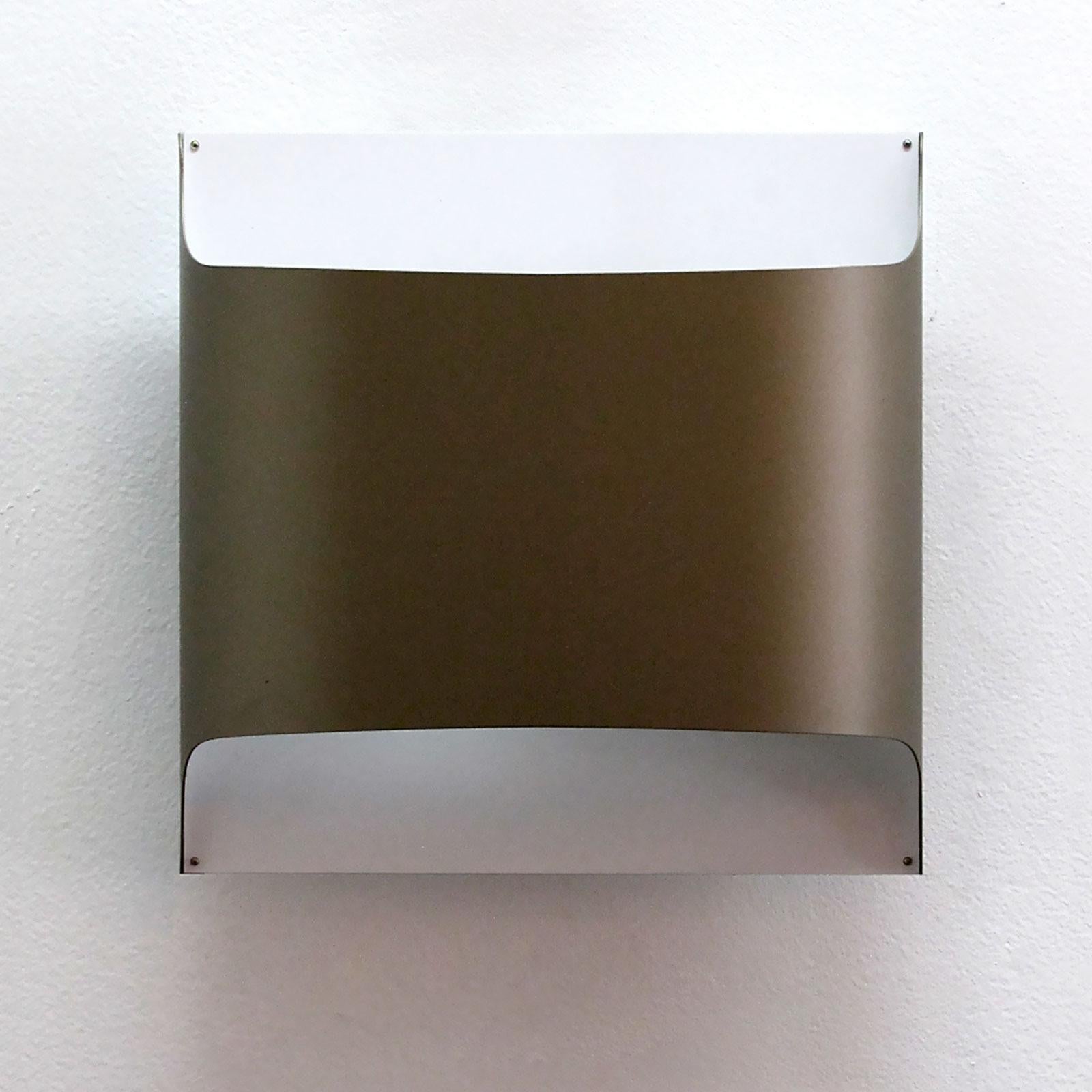 Minimalist folded metal wall lights by Staff of Germany in ivory-white and near bronze-brown color, can be used as flush mount ceiling lights as well. Designed by R. Kruger & D. Witte in 1968. Wired for US standards, one E27 socket each, max.