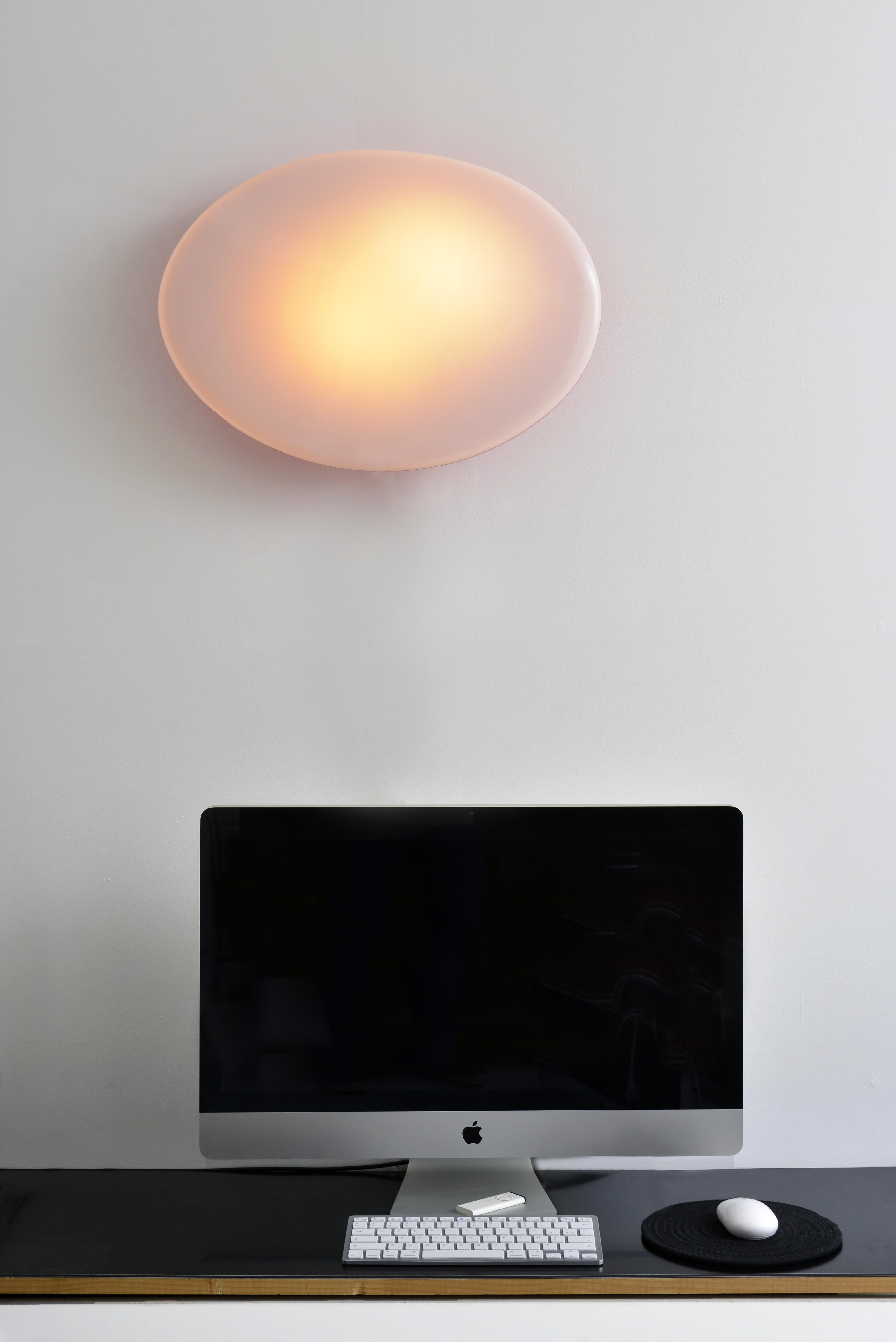 Wall lights, designed by Patrick Jouin in the early 2000s, published by Artémide for a hotel chain (not commercially available). Two-coloured thermoformed Plexiglas on a metal support, receiving two standard screw bulbs. Very soft and diffuse