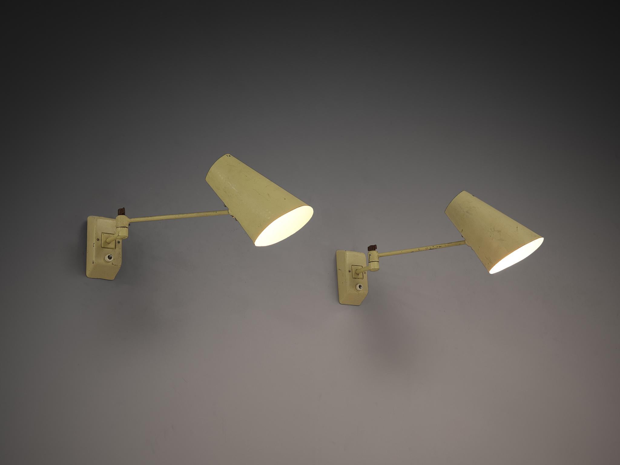 Wall lights, lacquered metal, Europe, 1950s

Simple and modest mid century wall lights in pale yellow. These lights are made in lacquered metal with adjustable rods and shades. The base of the lamps is attached to the wall and the light switch is