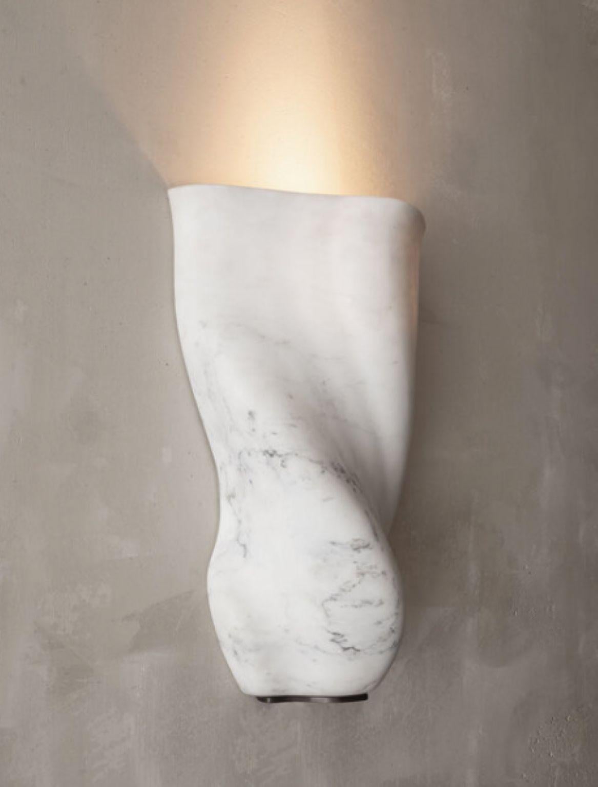 Wall marble sconces by Jonathan Hansen 
Dimensions: W 32 x D 15 x H 49.5 cm
Materials: Calacatta Marble


Series I Captum Biomorfe is a group of nine sculpture works created by New York artist Jonathan Hansen. Captum is a seized or captured