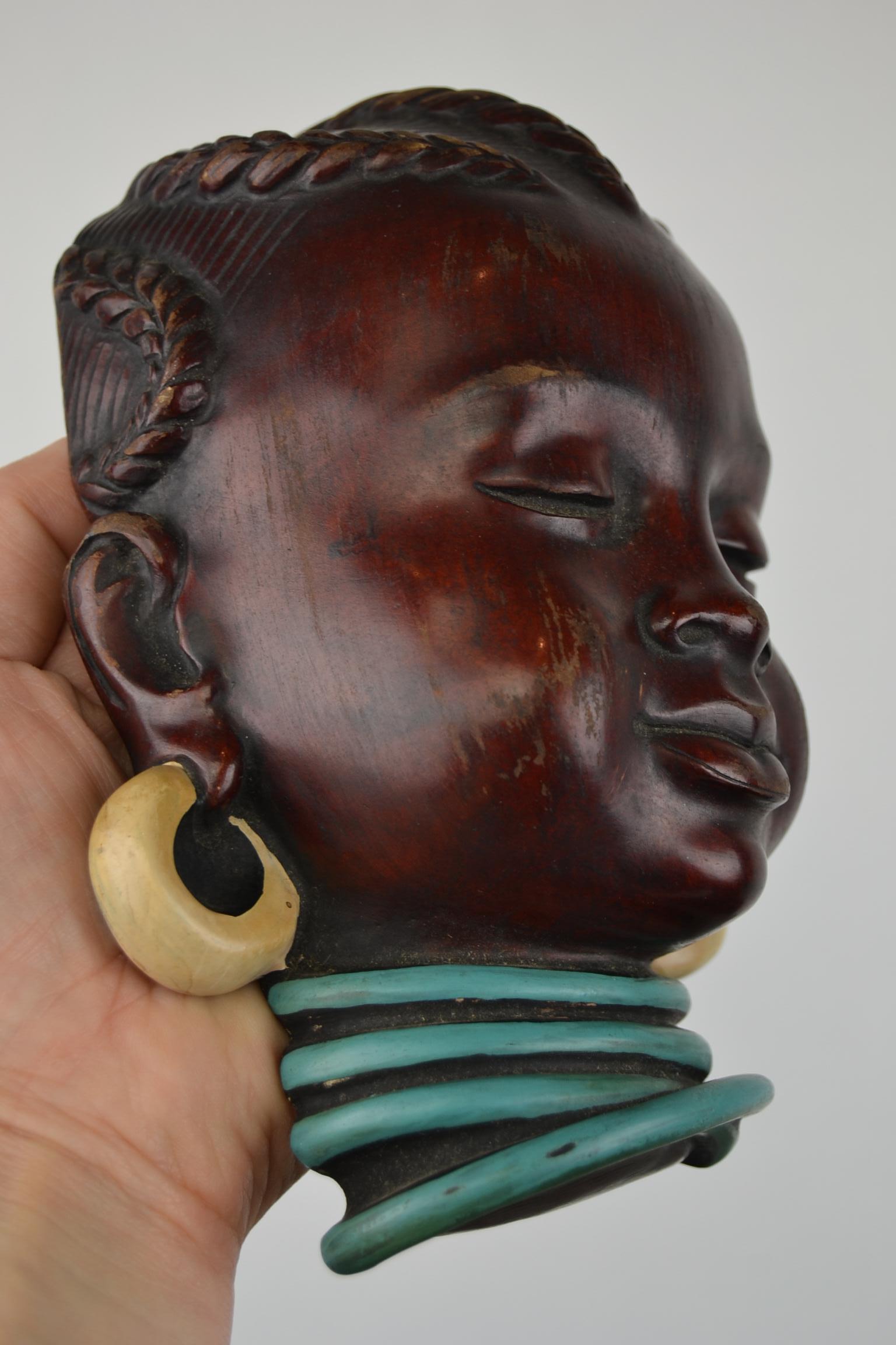 Vintage Afro Child , Afro Woman Wall Mask which looks great.
This wall head decoration is very detailed and was made in Germany.
This German pottery mask dates circa 1950-1960.
It's made from a special mix of Grindet stone and wood with binder,
and