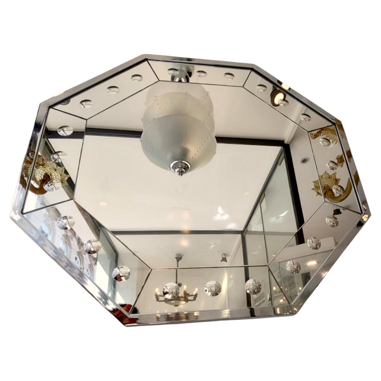 Very decorative octagonal wall mirror, chromed metal frame and faceted and hand-carved crystals.
It can be very useful in a hall on a console, or also in the bedroom.
