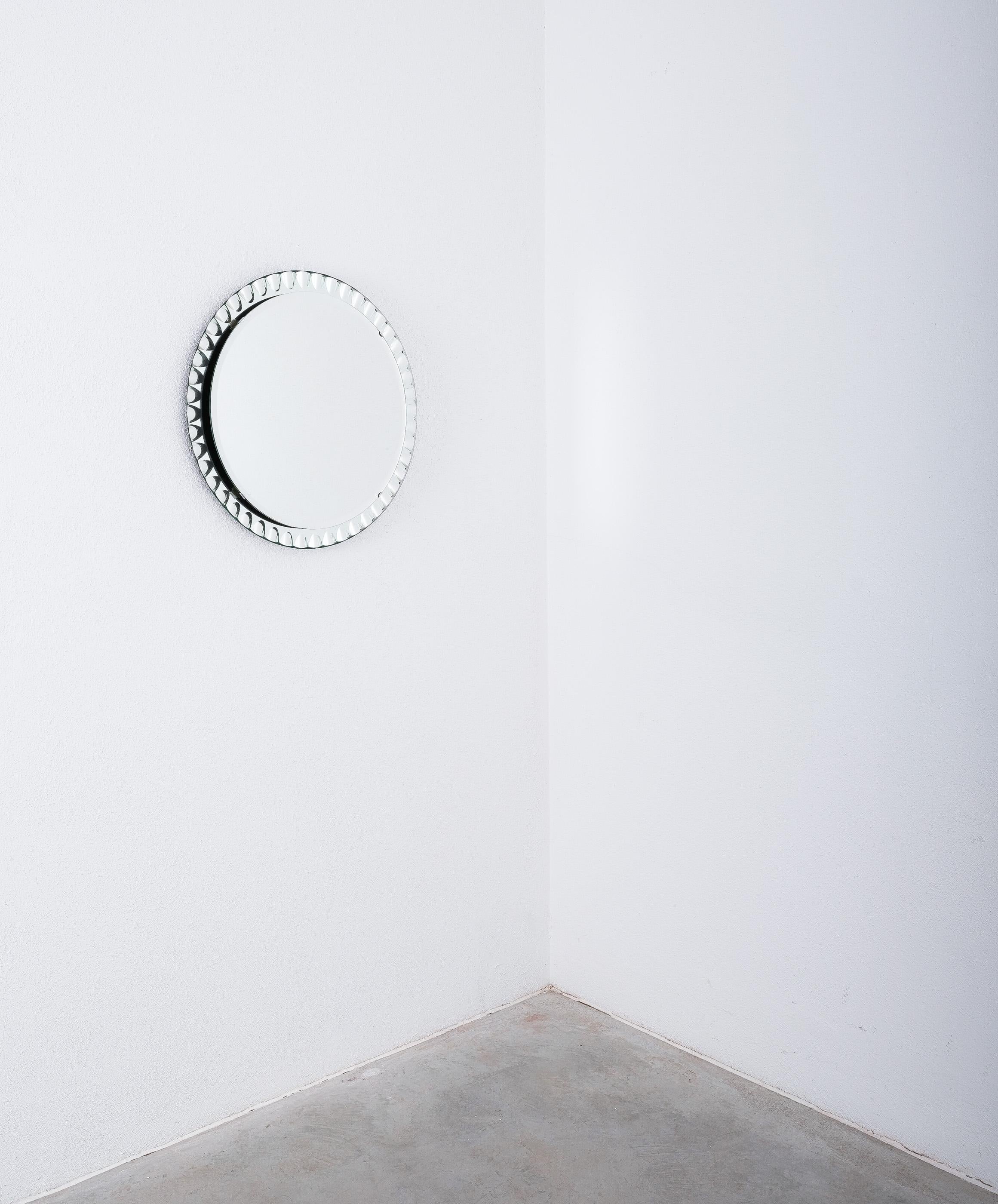 Wall mirror by Cristal Art, Torino, circa 1955 glass mid-century. 

27” wall mirror with a mirrored optical glass frame and a round central mirror (20