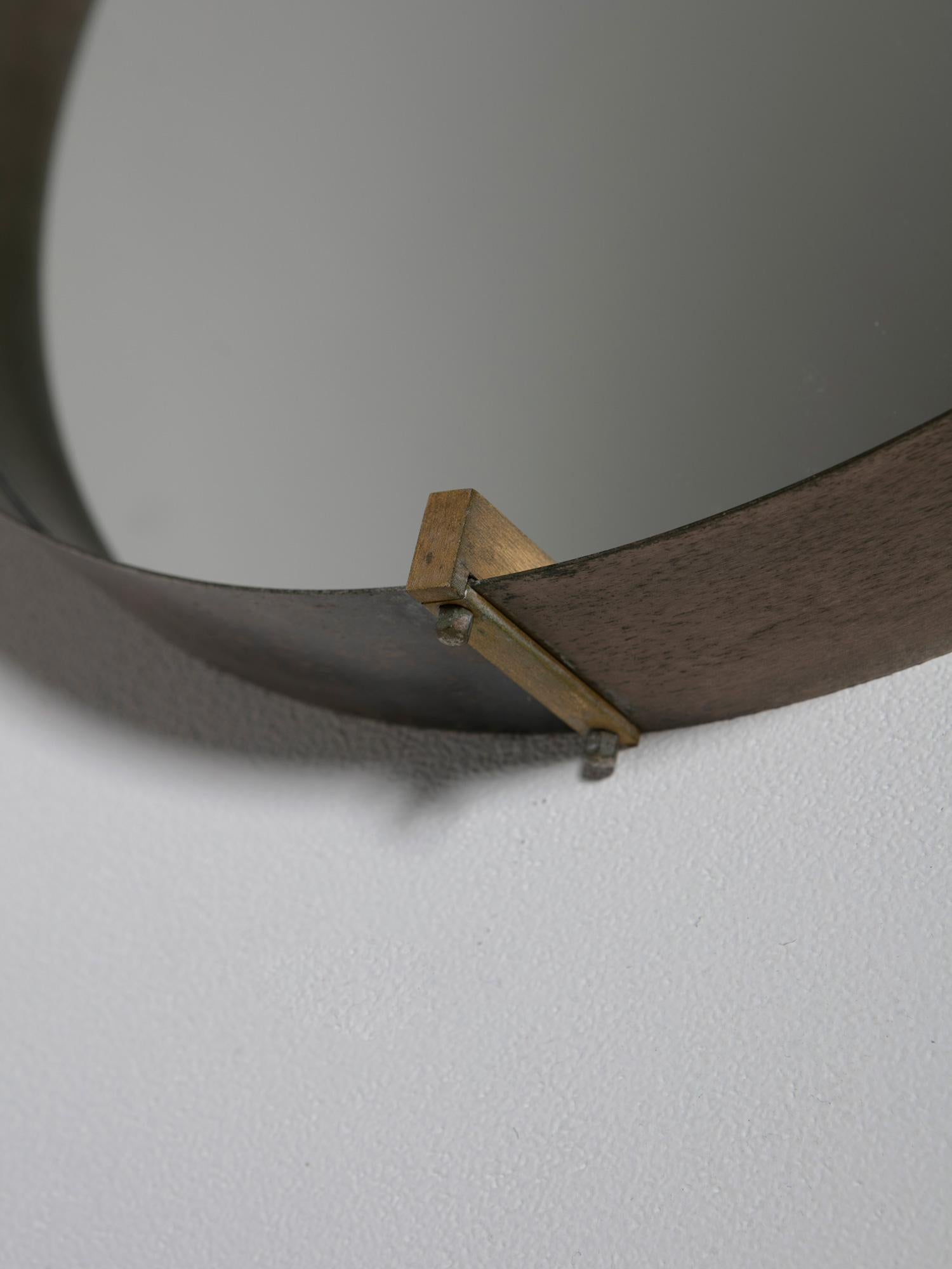 Steel frame with brass details for this double sided wall mirror manufactured by Santambrogio and De Berti.