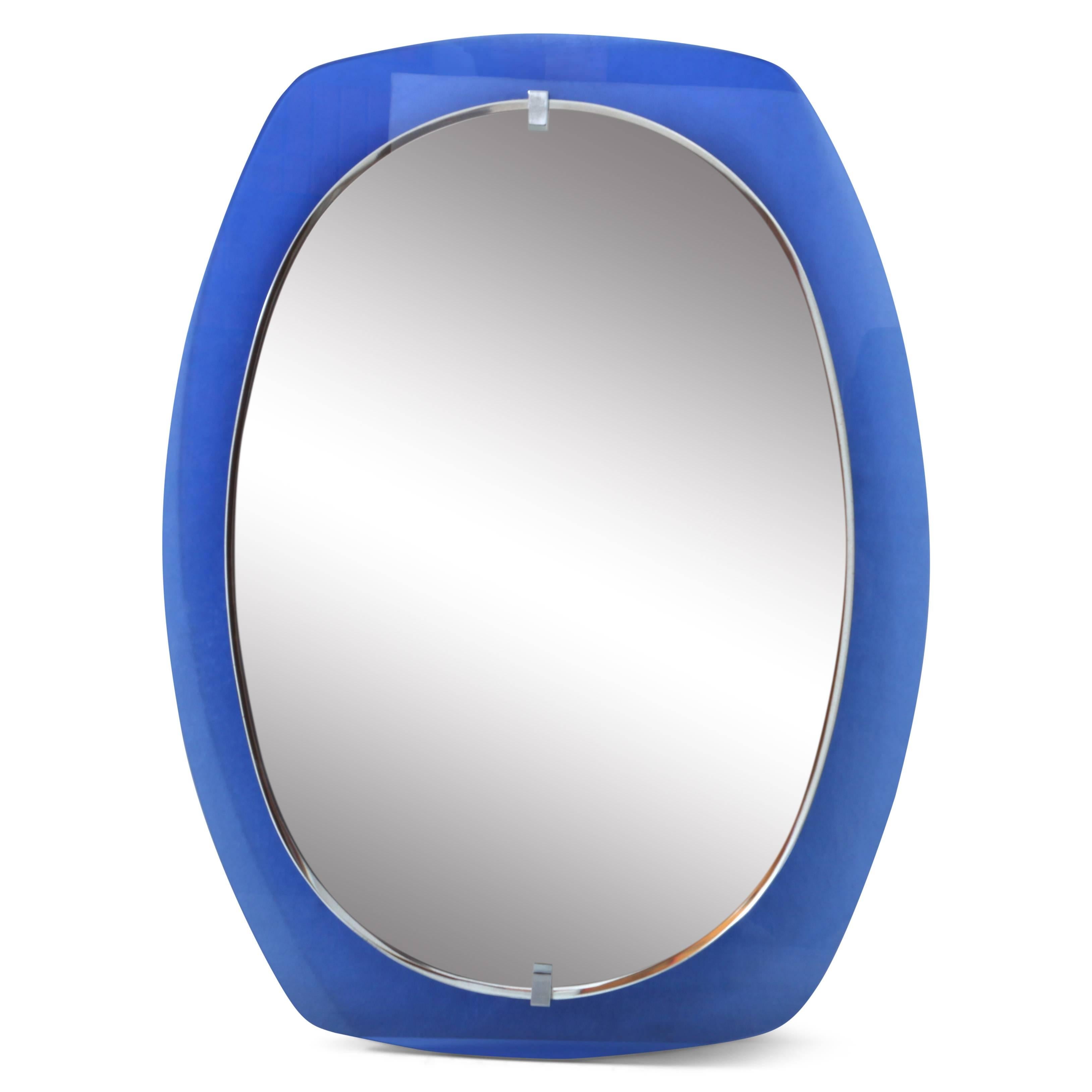 Italian wall mirror with a blue glass frame and an oval mirror pane by Veca.