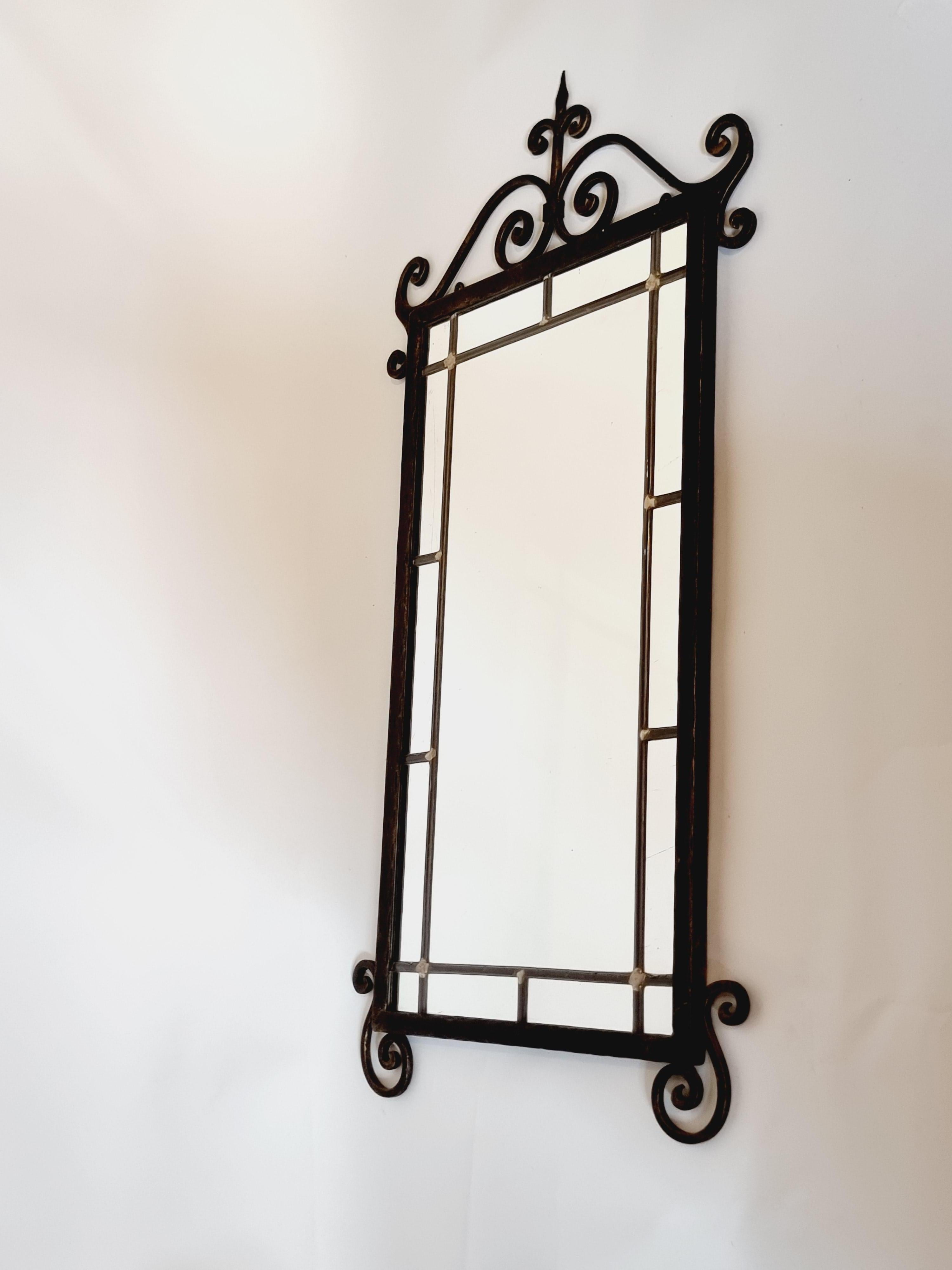 Cast iron wall mirror with beautiful, decorative ornaments. A timeless piece that works in most rooms and interiors.

Swedish Grace, 1930/40s. Signs of age and wear, mirror glass with a few natural fadings. 