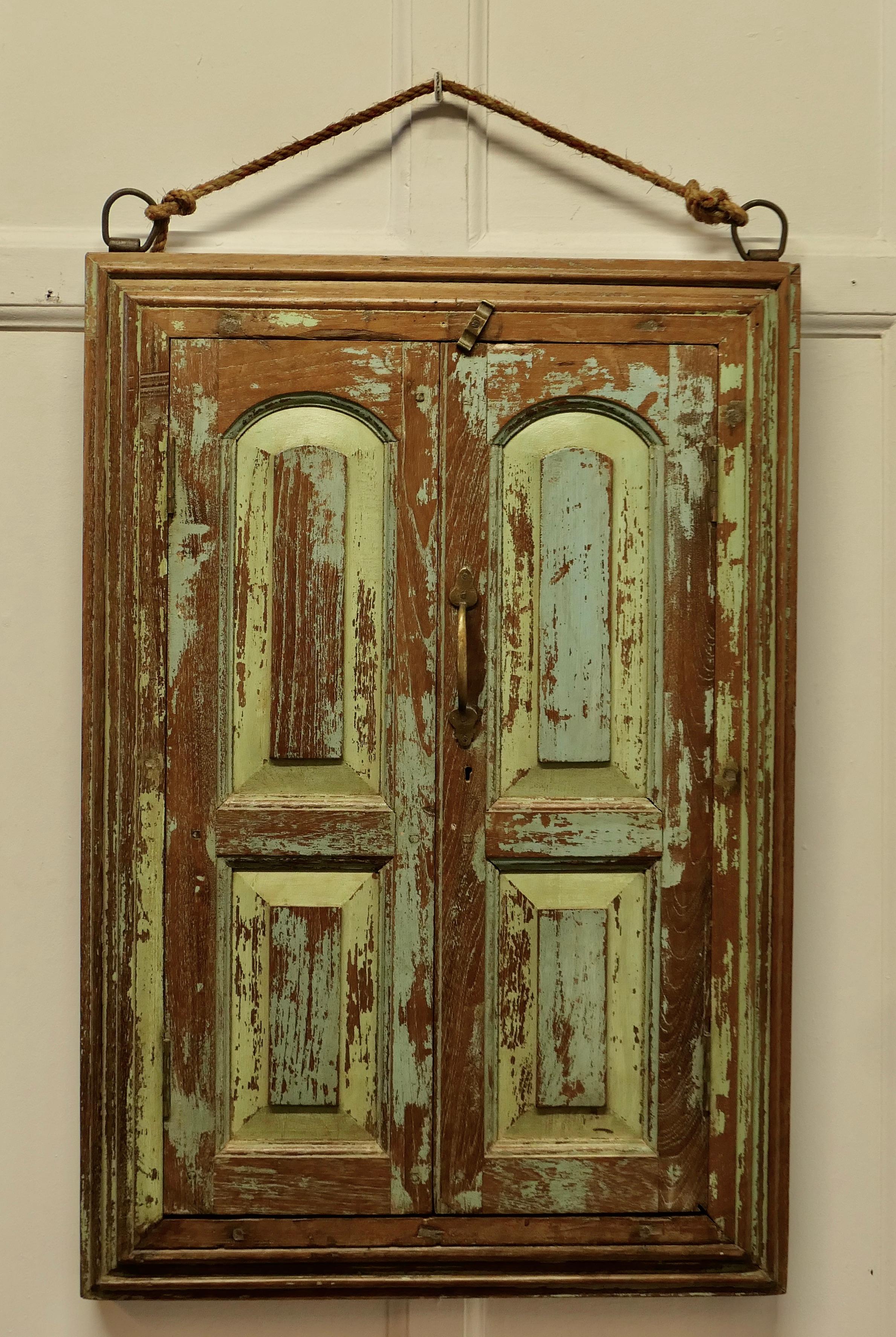 Wall Mirror Concealed by Heavy Oak Door Frame/Shutters

This very attractive Panelled Oak Double Door Frame conceals a mirror
The pair of doors have their original metal hinges and wooden closer, they were once painted in a pale blue now mostly worn