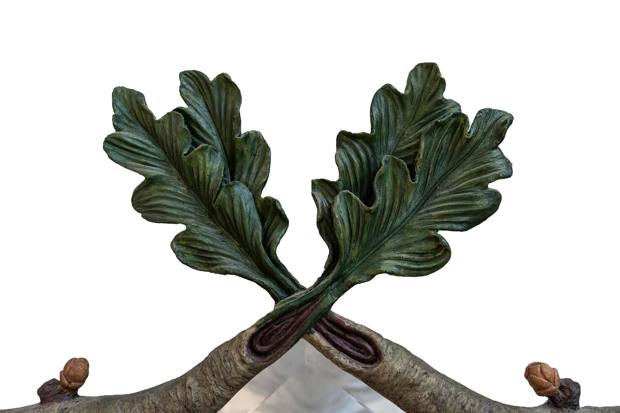 Wall mirror, sculpted resin in the shape of branches and foliage, France, circa 1970.

Measures: 90 x 145 cm.