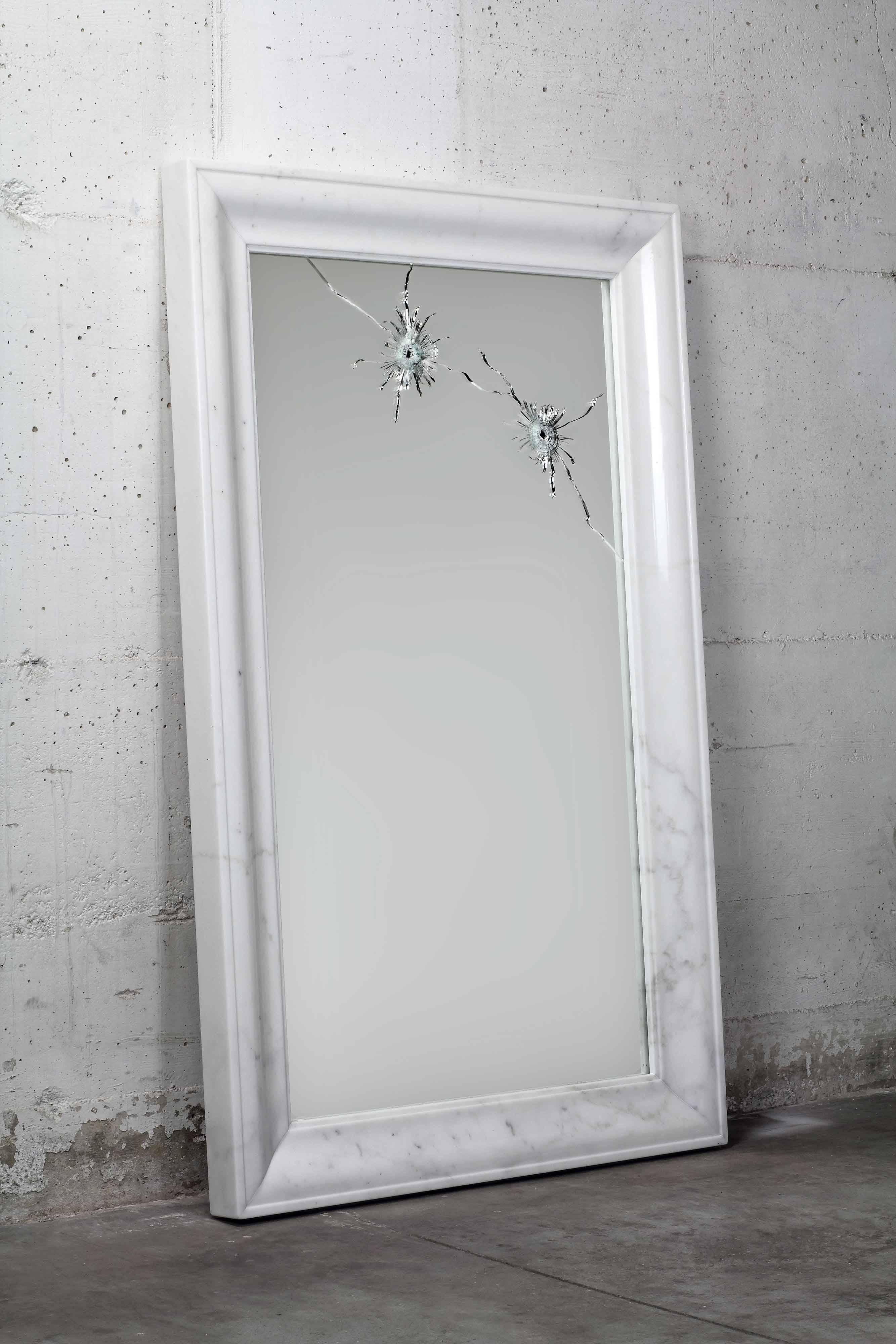 The 'Seven Years' wall mirror is made of security-glass, mirror hit by gunshots and frame in polished Statuary marble (origin: Tuscany). 

Mirror dimension: H 120 x W 75 cm. Dimensions are customizable.

Limited Edition of 15.

Each mirror is hand