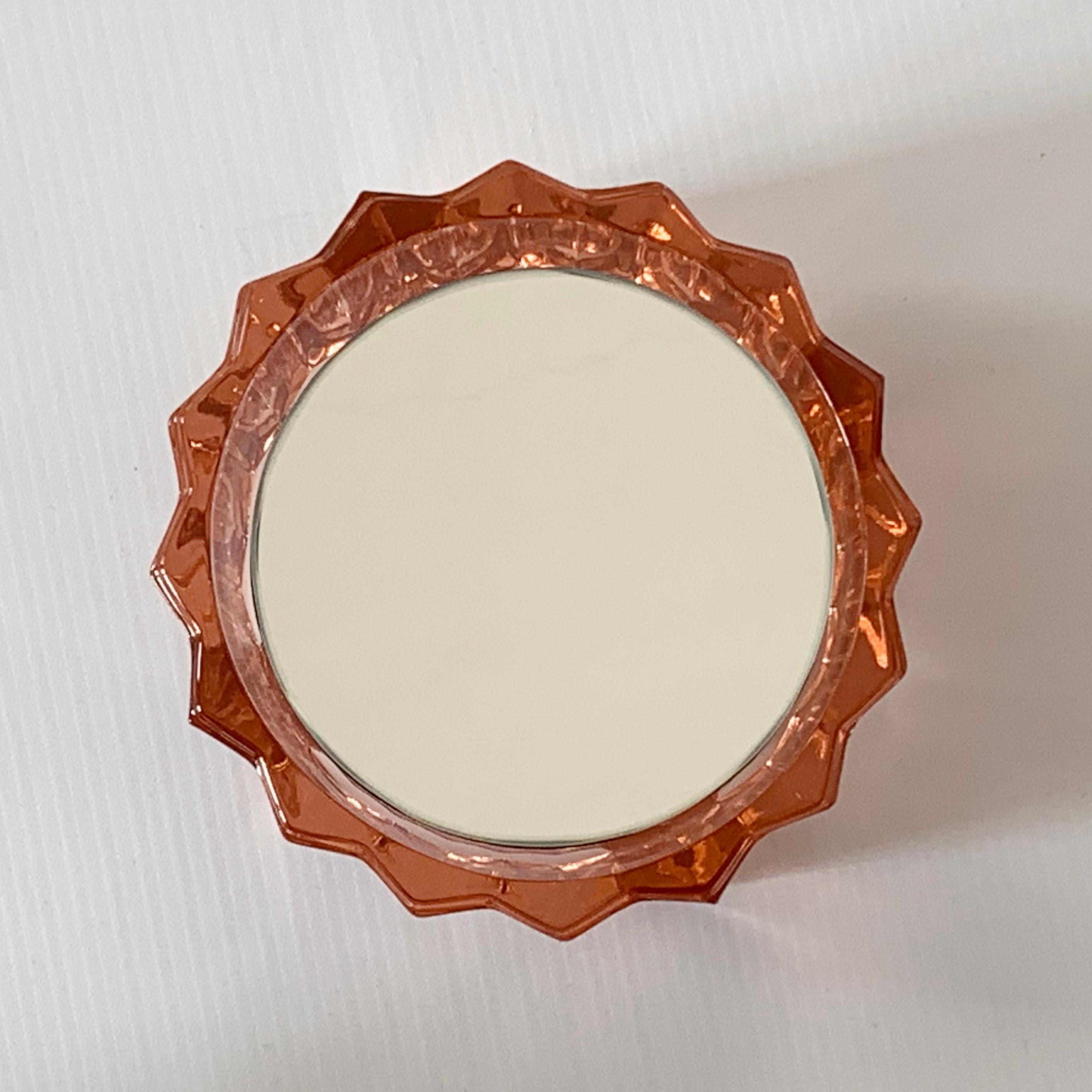 Small wall mirror (many models available: different shapes, sizes and colors). 

