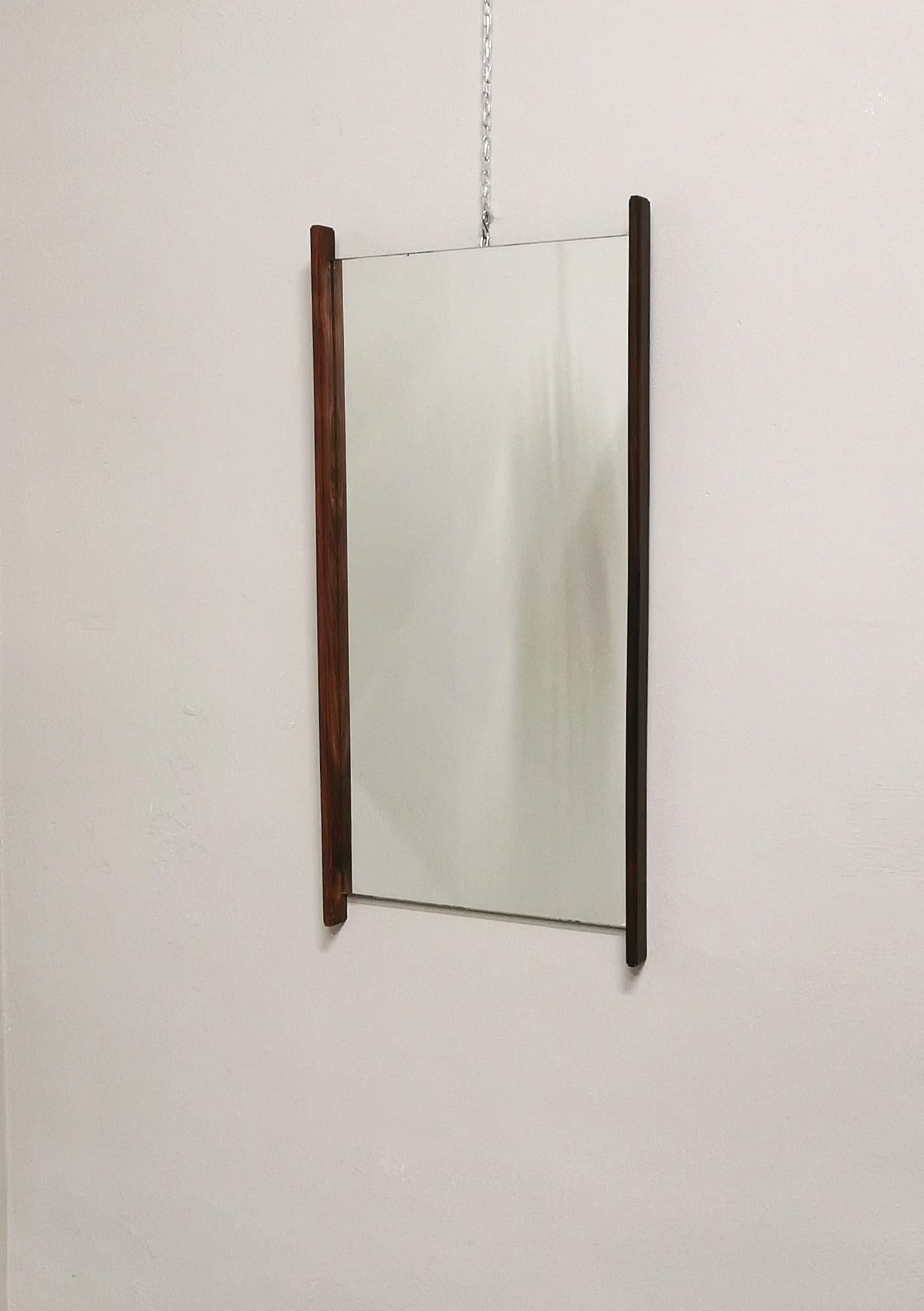 Large rectangular wall mirror with a teak wood finish on the edges. Made in Italy in the 70s.


Note: We try to offer our customers an excellent service even in shipments all over the world, collaborating with one of the best shipping partners, DHL,