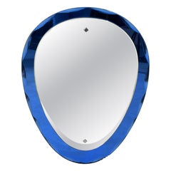 Wall mirror with a faceted colored glass frame attributed to Cristal Arte, 1960s