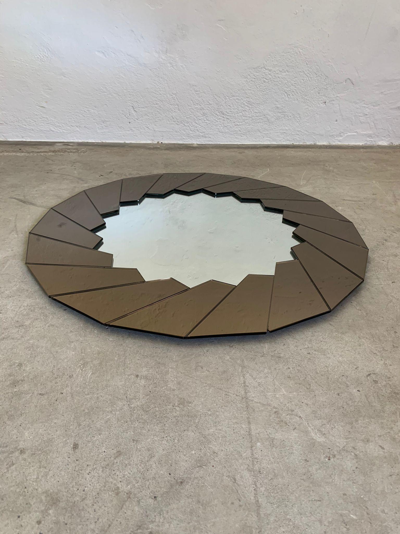 Wall mirror with glass frame attributed to Gae Aulenti, Semiramide, Italy, 1970s

Wall mirror with irregular glass sunburst frame attributed to Gae Aulenti.  Imperfections visible in photo.

