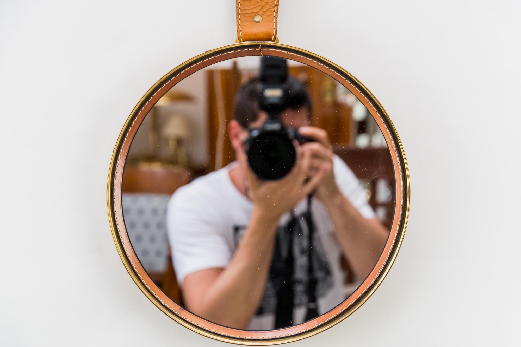 Wall mirror with leather, circa 1950s
Original condition.