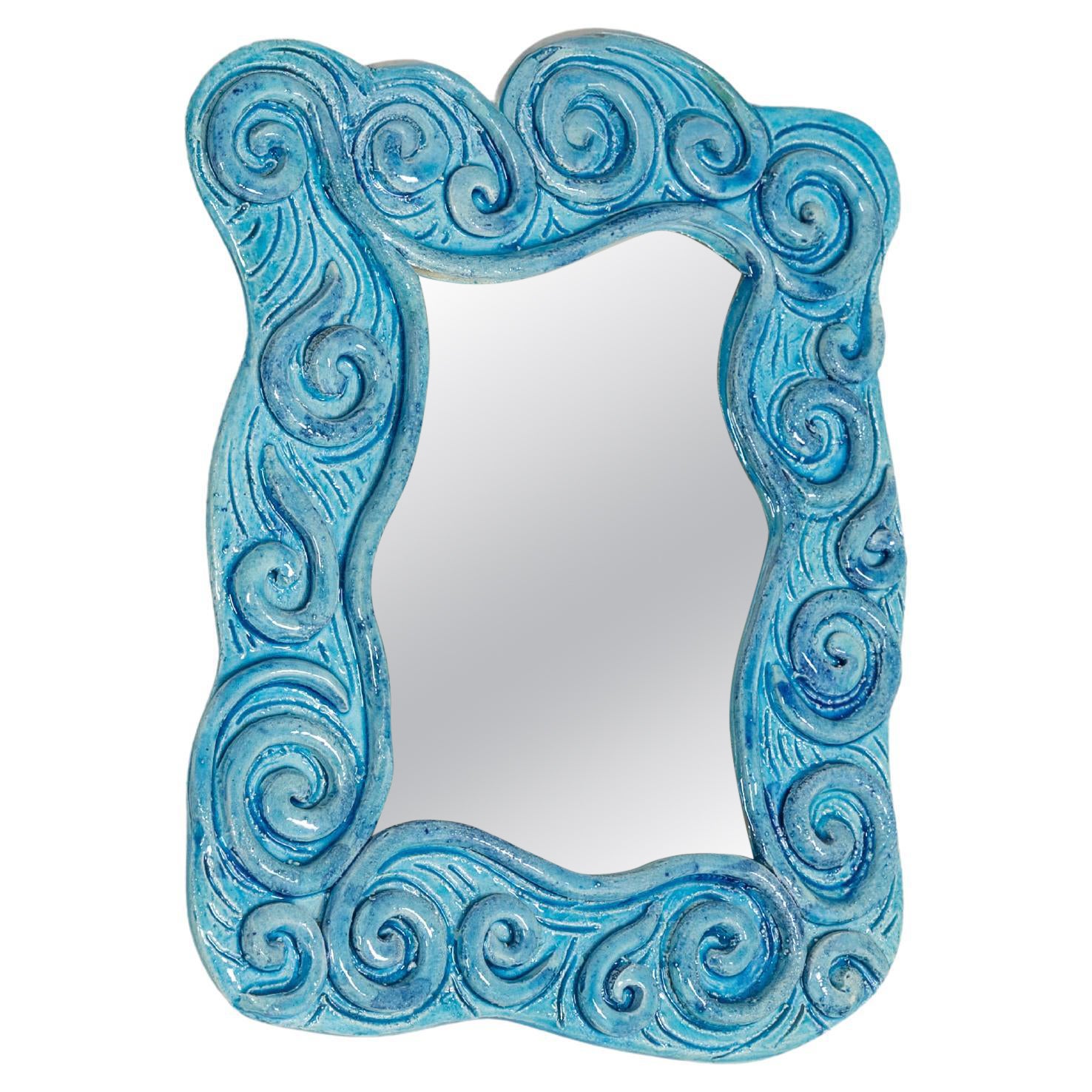 Wall mirror with light blue ceramic frame