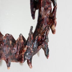 Wall mirror with red ceramic frame