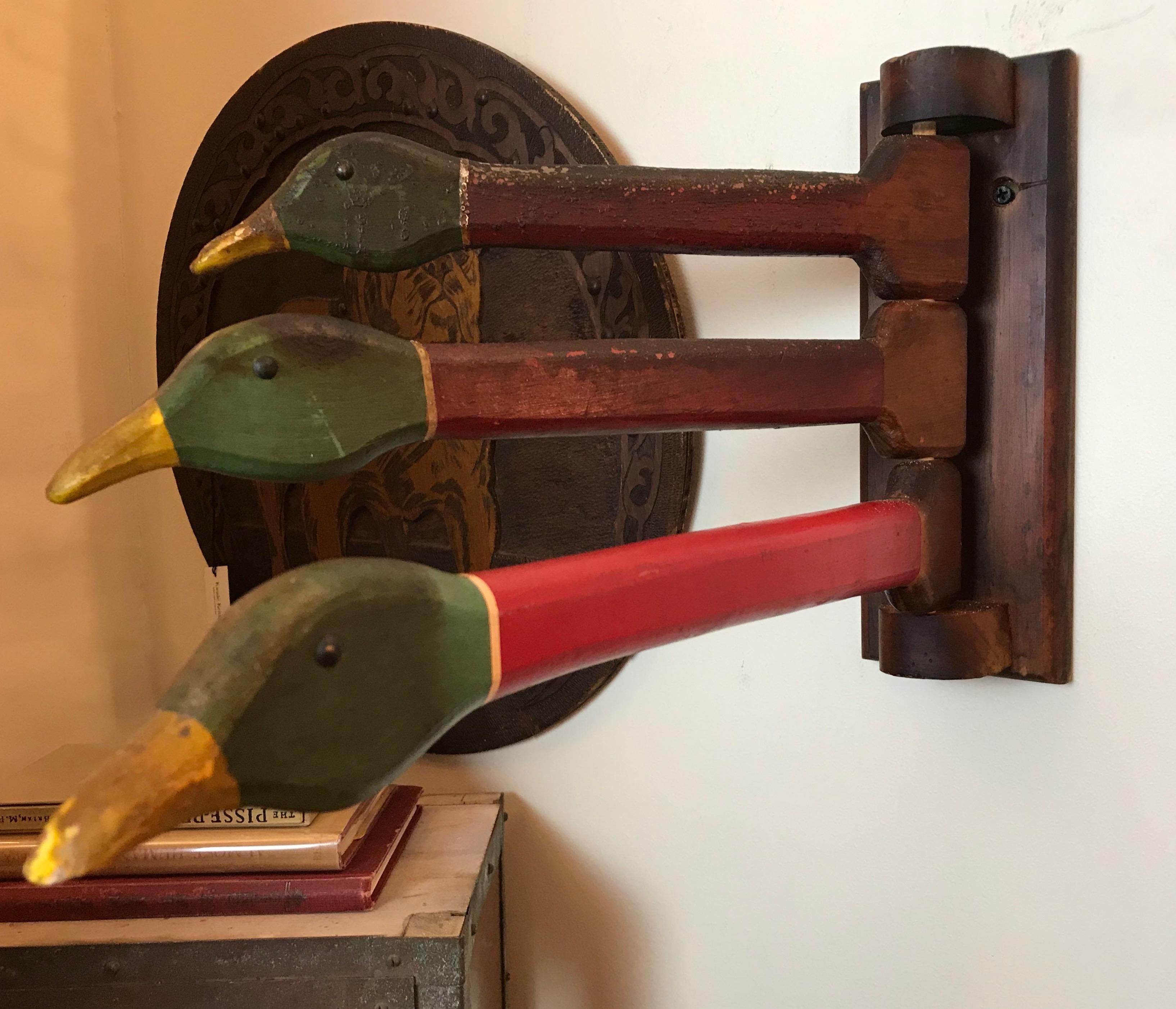 This is a charming hand painted Folk Art towel holder in the form of three mallard ducks. The top and middle duck have the most patina and wear from use over the years. Each duck can be rotated left or right. Great all original surface paint.