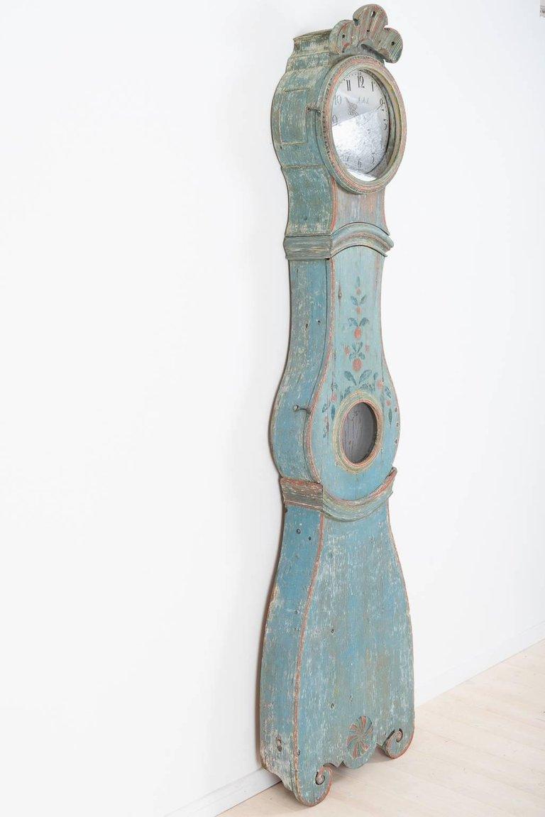 Dry scraped to the original painting, Sweden, circa 1780. It has unusually well made locks and hooks in forged iron. Many clocks were hung on the wall in old times hence the hole in the back that often can be found. No one knows for sure why but a