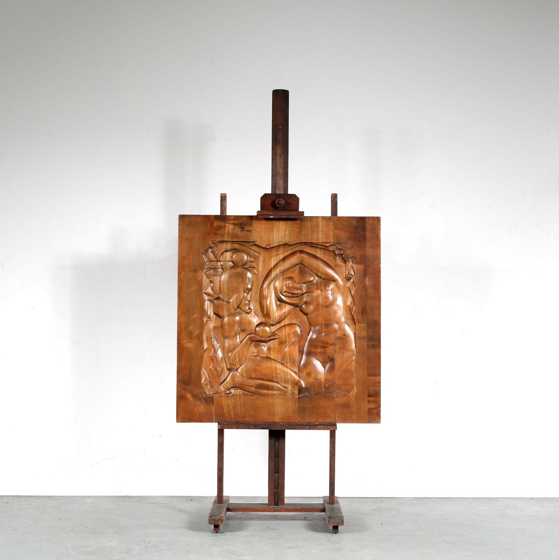 A fantastic wall mounted wooden artwork made by Barend Jordens in the Netherlands around 1920.

The square piece has a beautiful drawing carved into the wood, in the shape of Adam and Eve and the forbidden fruits. The quality, warm brown wood