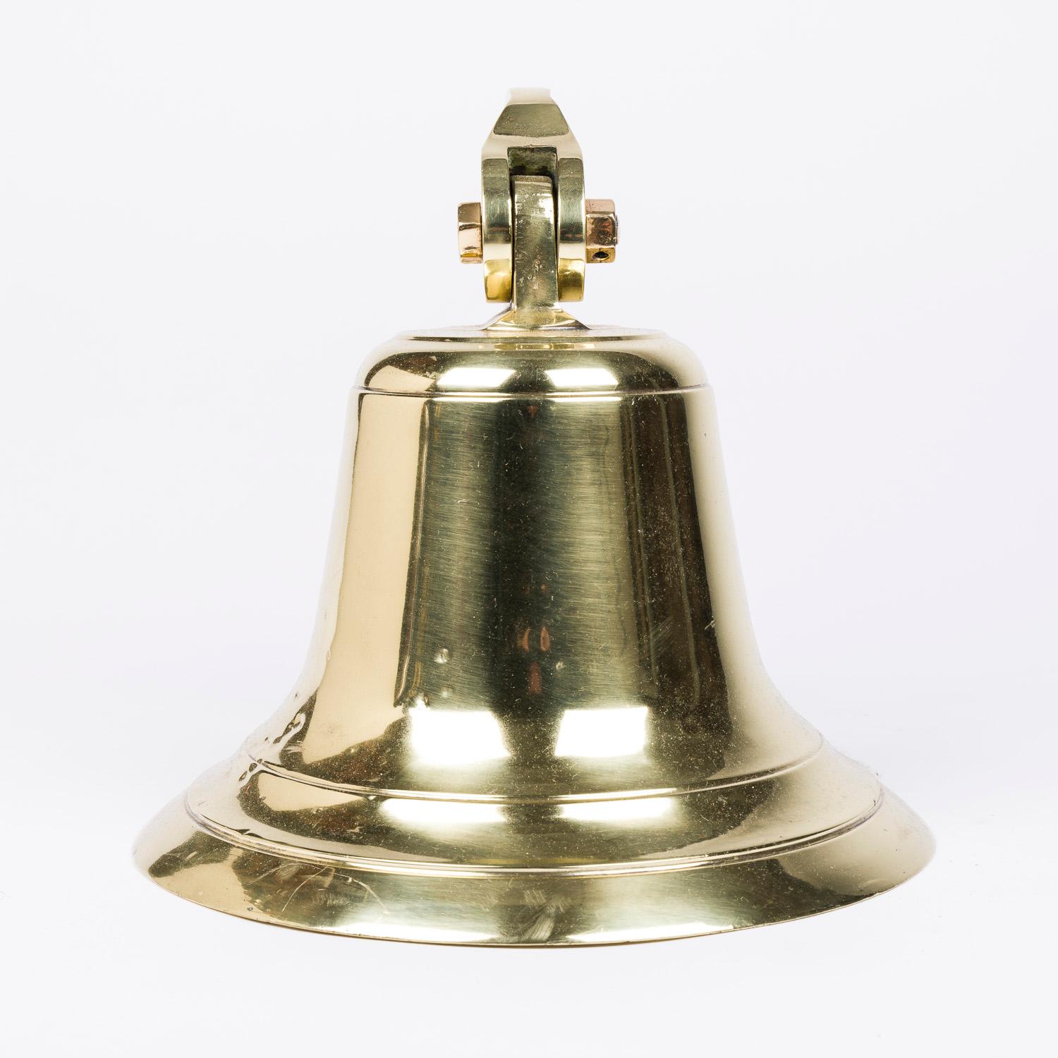 An early 20th century wall mounted bell, with brass bracket.

Projection from wall: 15 inches.

Original iron ball clapper.

The bell has a nice ring and good resonance.

