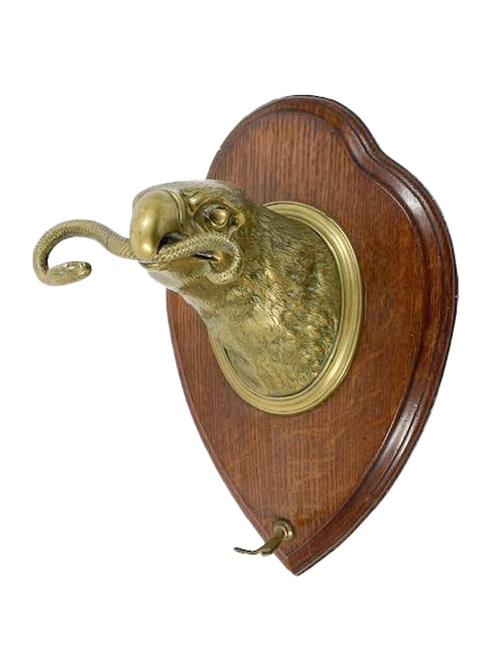 Wall Mounted Brass Eagle Head on Oak Plaque Holding a Dinner Gong by Wm. Tonks For Sale 6
