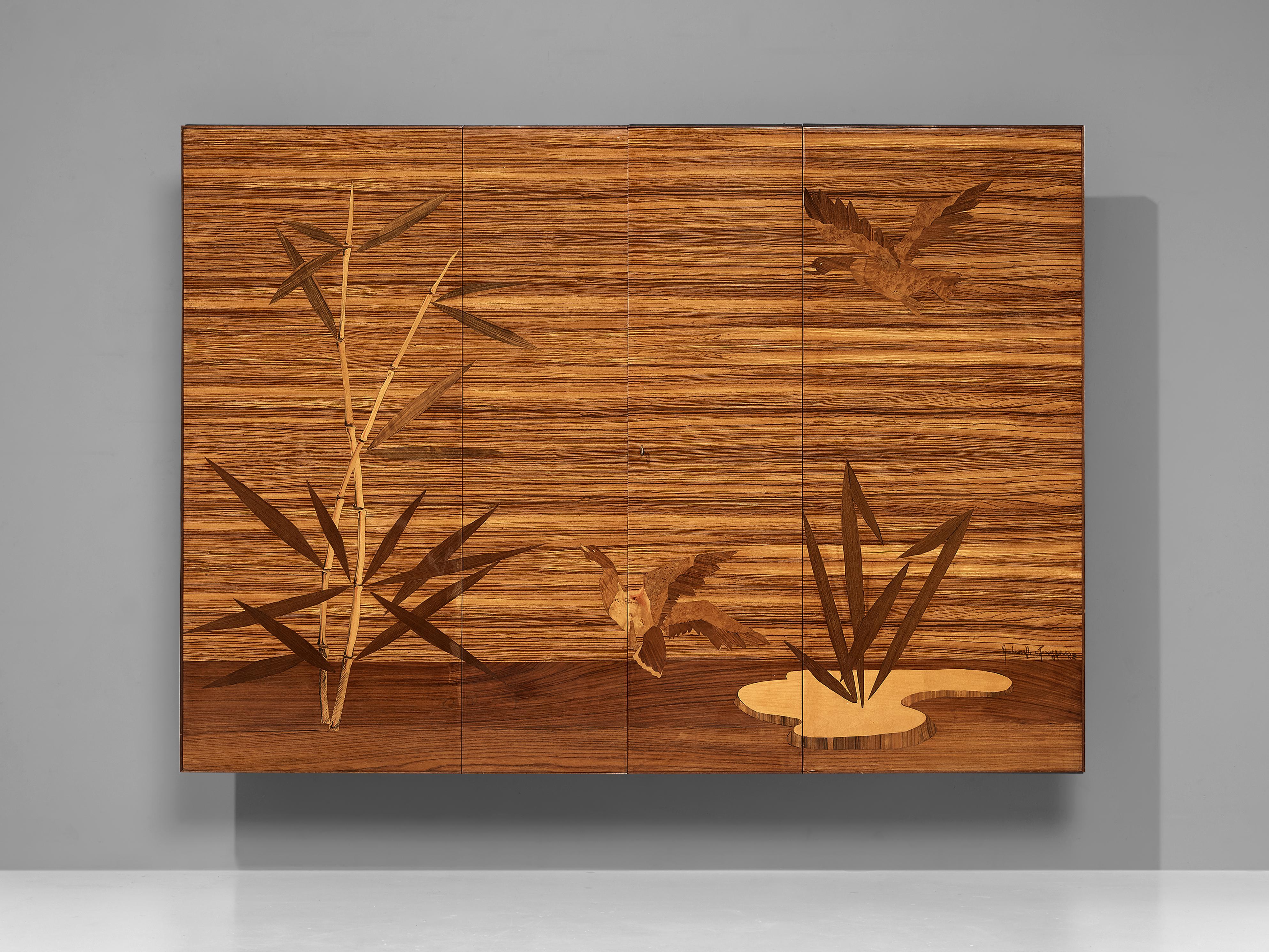 Wall-mounted cabinet, maple, walnut, wengé, brass, Italy, 1960s

A scenic marquetry highlights this elegant wall-mounted cabinet. The large front features two flying birds in a picturesque surrounding. The gooses have their wings spread and fly into