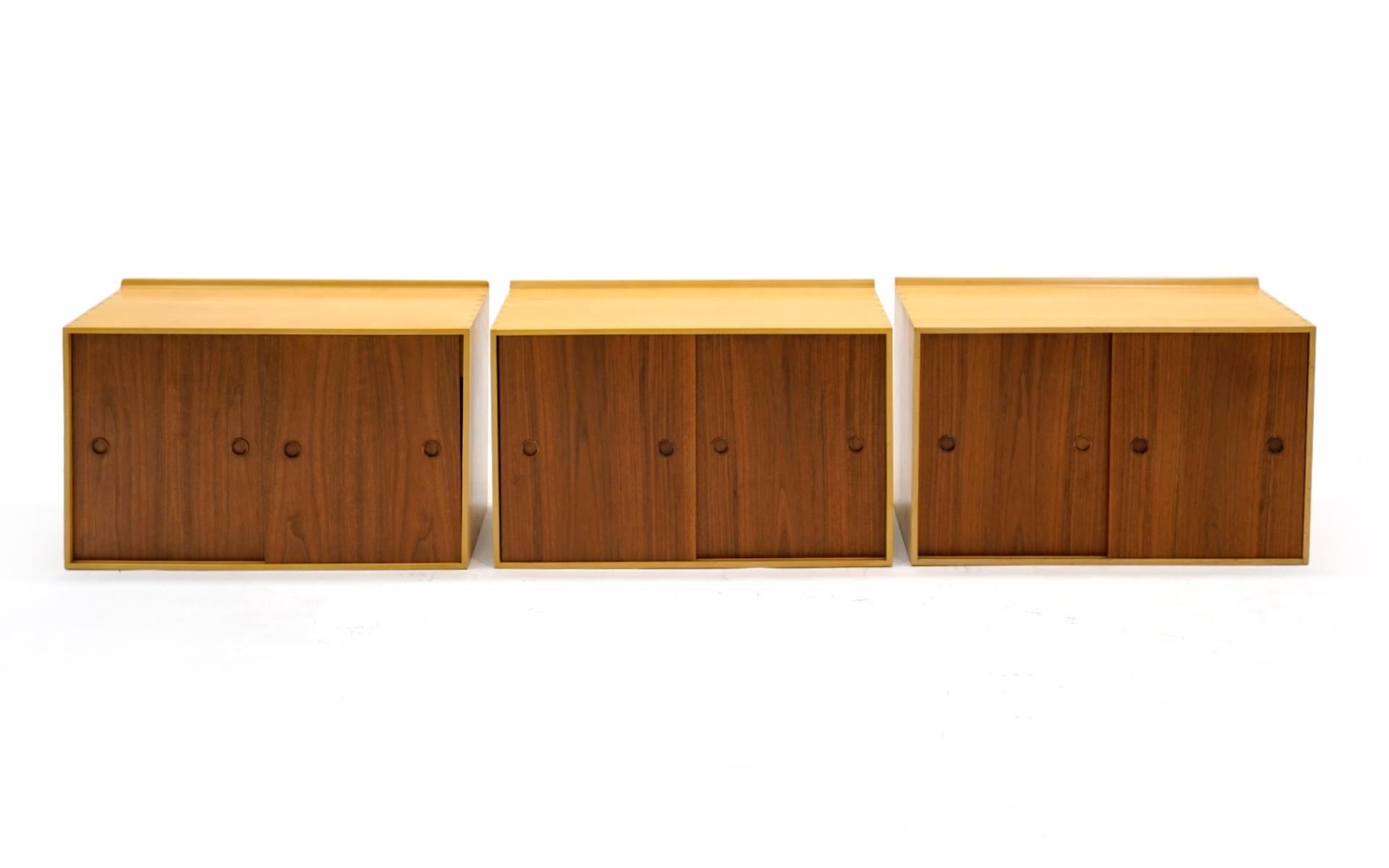 Set of six wall mount cabinets / wall unit designed by Finn Juhl and manufactured by Baker, 1950s. The entire set is in very good condition, Beautiful grain pattern in the walnut door fronts making for a striking contrast with the birch cases. Each