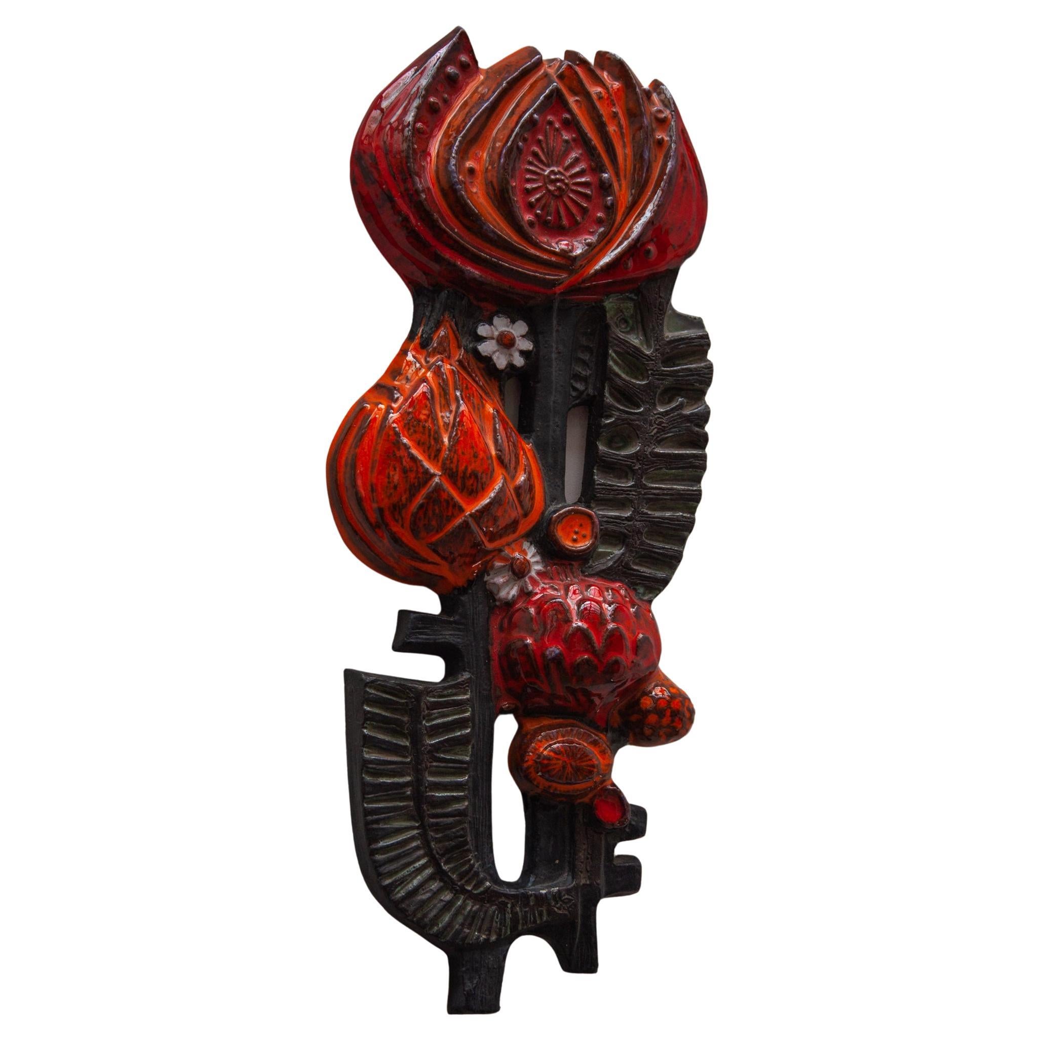 Beautiful abstracted flower wall sculpture was a cooperation between Perignem and Paul Vermeire.
a colorful decorative ceramic wall mounted sculpture with colors in deep red, black and orange glaze. The sculpture is in perfect condition. It is not