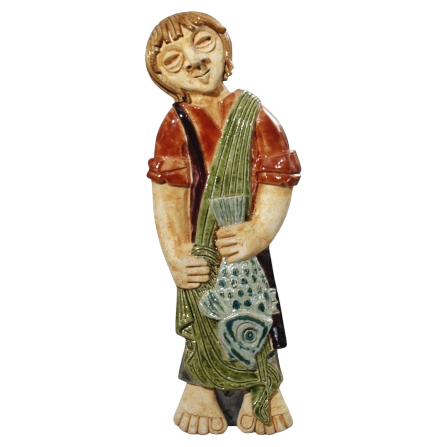 Wall mounted ceramic plaque of a fisherman by Atelier Kerbigot, 1960s For Sale