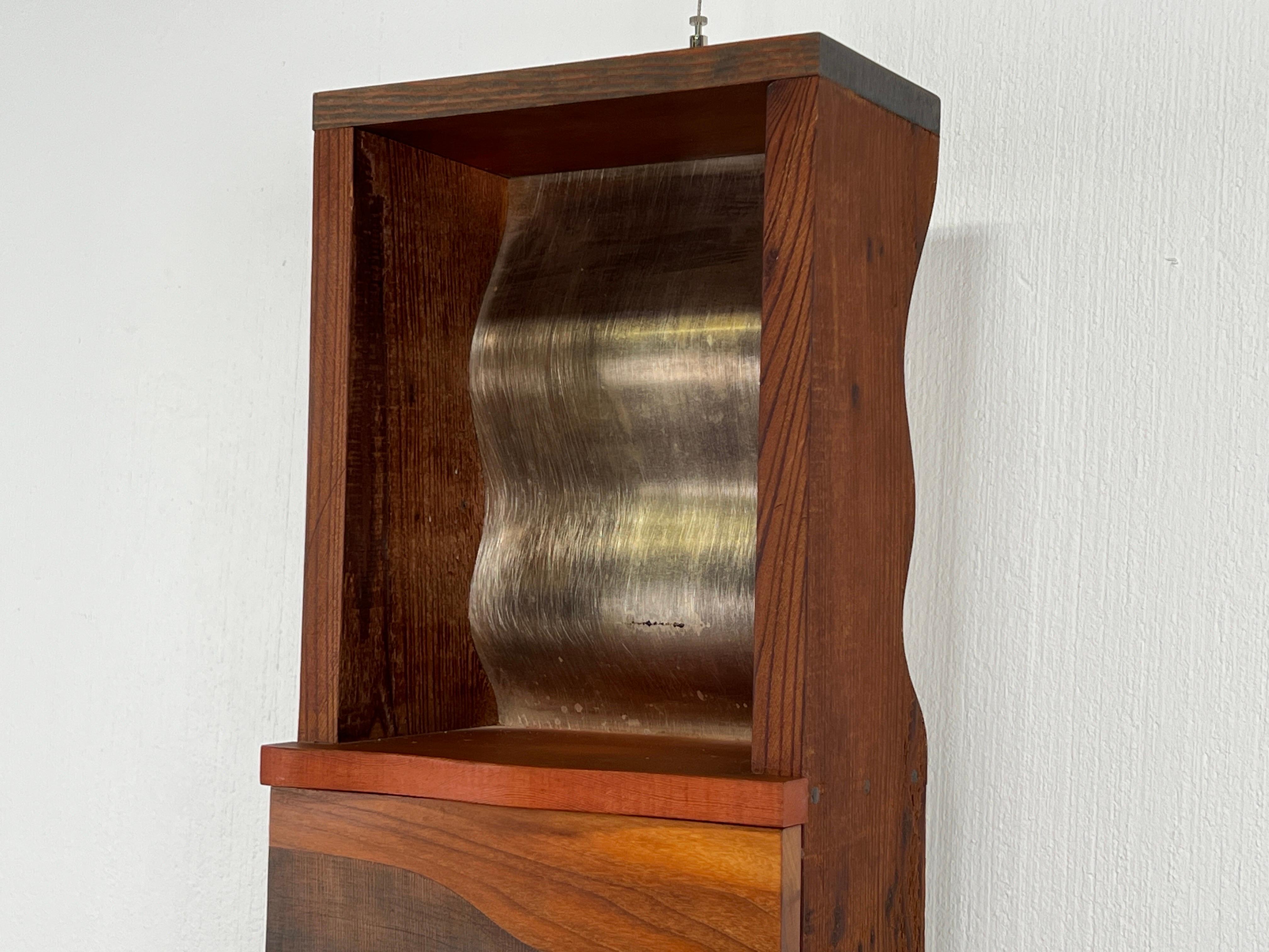 Metal Wall-mounted Clock Cabinet by Garry Knox Bennett