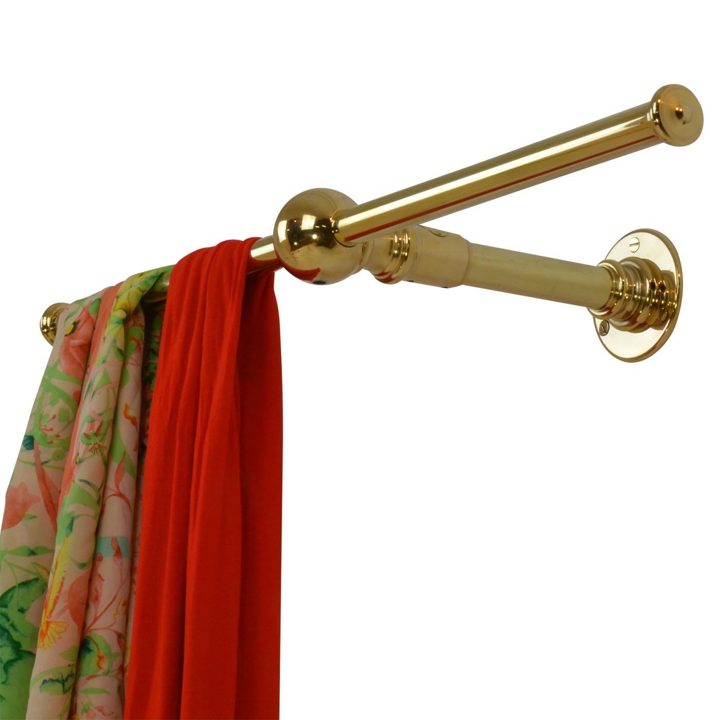 The Canterbury, an Andrew Nebbett Designs wall mounted clothes rail in solid brass. This Canterbury clothes rail is tailor-made to order and is handmade, colored, patinated and finished in our English workshops from the finest quality
