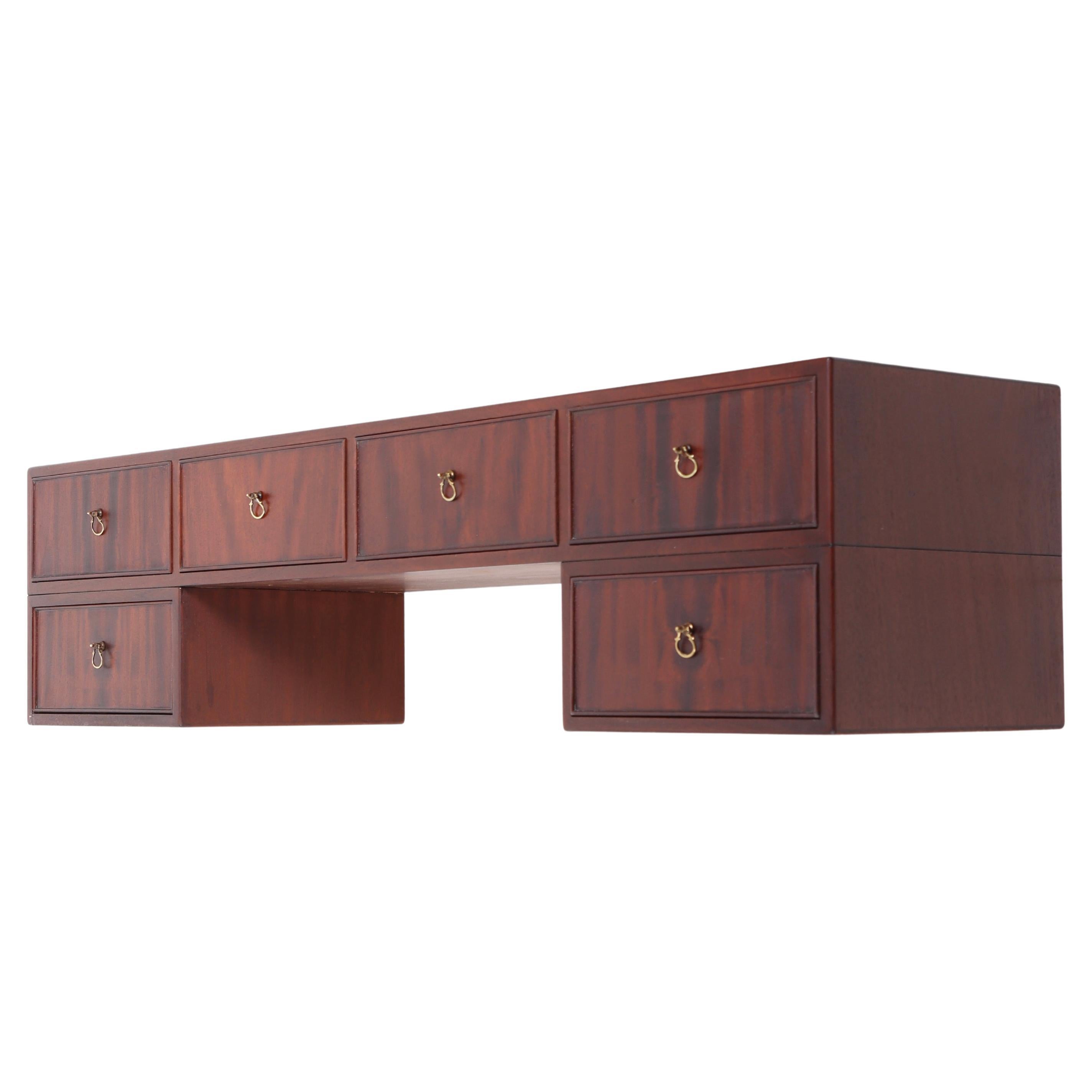 Wall mounted console table in mahogany with drawers, designed and made by cabinetmaker Frits Henningsen. Made in Denmark, great original condition.