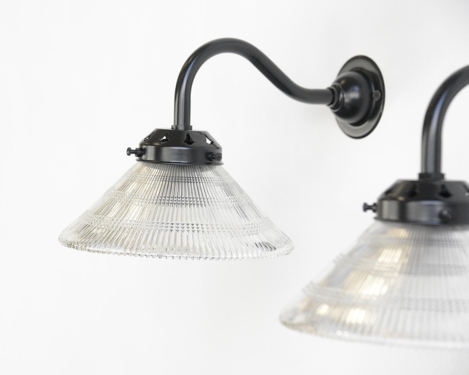 Wall-mounted Holophane lights, circa 1920s

- Price is per light (8 available)
- Prismatic glass shades
- Curved arms
- Takes E27 fitting bulbs
- Wire directly into the wall
- Dutch, 1920s
- Measures: 26cm deep x 17cm wide x 18cm