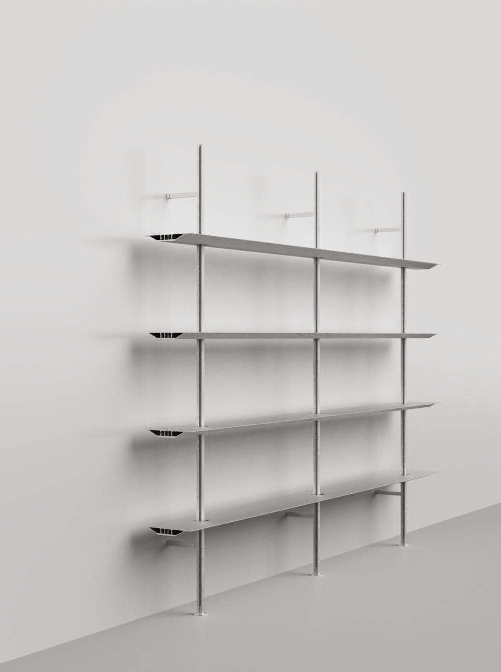 The Hypostila shelving was designed in 1979 by Lluis Clotet and Oscar Tusquets to support important amounts of weights on minimum profiles, reaching an infinity of lengths and planifications. t is constructed using extruded aluminium profiles where