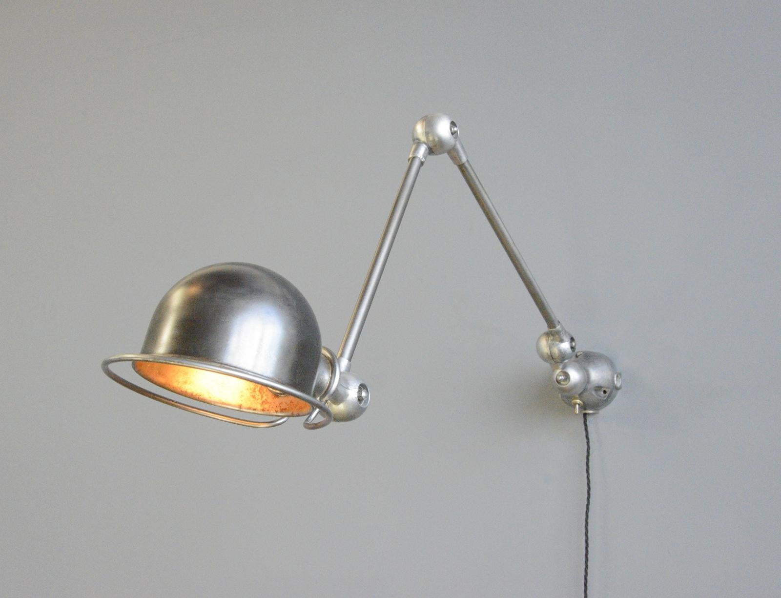 Wall Mounted Industrial Lamp By Jielde, circa 1950s

- Articulated arms and shade
- Brushed steel shade
- Cast Aluminium knuckles
- Takes B22 fitting bulbs
- On/Off switch on the wall moubnt
- Designed by Jean Louis Domecq
- Produced by