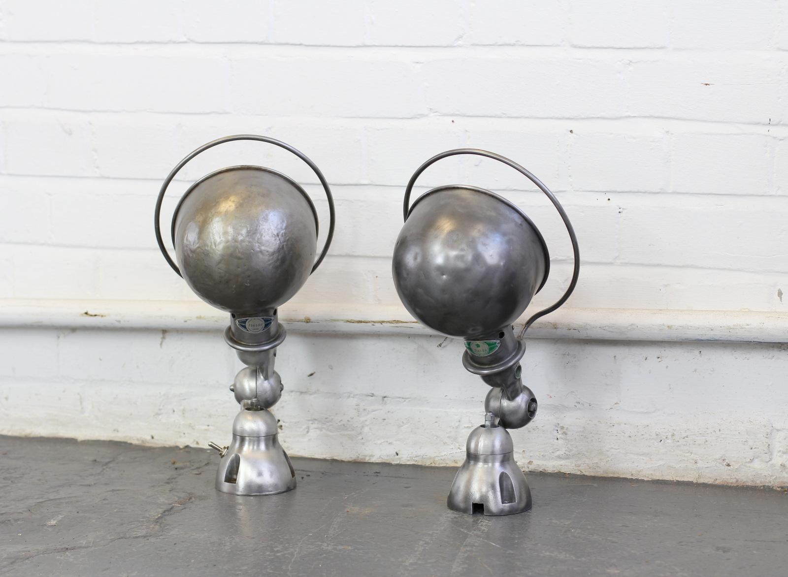 wall-mounted Industrial lamps by Jielde, circa 1950s.

- Price is per lamp (two available)
- Brushed steel and aluminium
- Lightly polished and clear lacquered
- Articulated
- Takes e27 fitting bulbs
- Inline on/off switches 
- French, circa