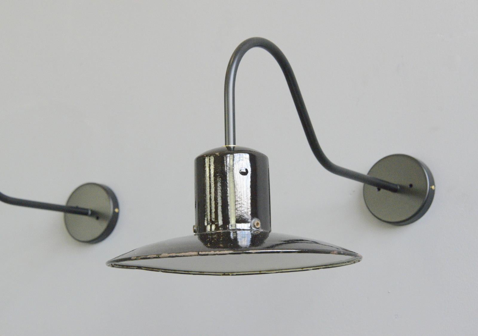 Wall mounted Industrial lights Circa 1950s

- Price is for the pair
- Steel arms
- Vitreous black enamel shades
- Takes E27 fitting bulbs
- German ~ 1950s
- 30cm wide x 28cm tall x 62cm deep

Condition Report

Fully re wired with modern
