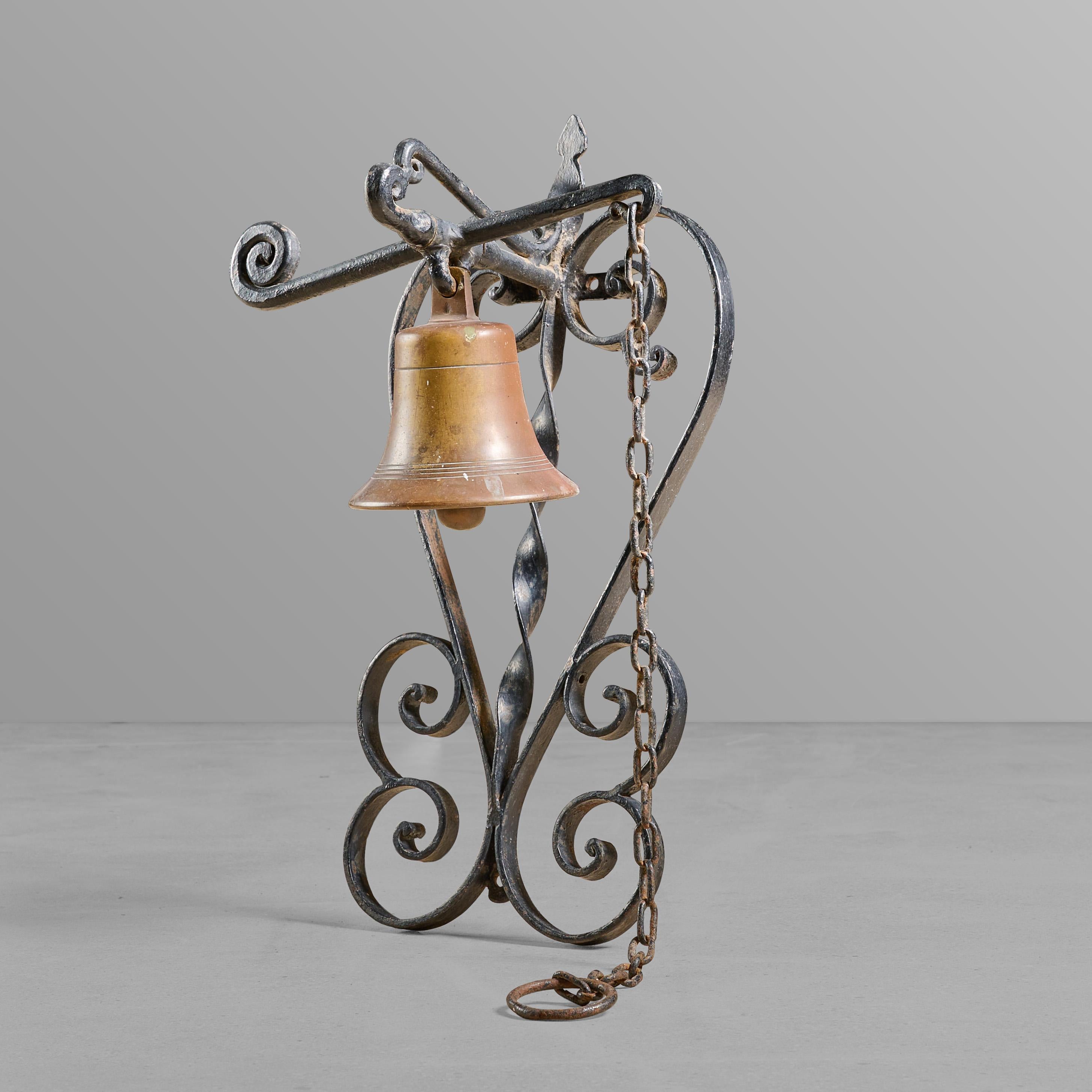 Wall mounted iron and bronze bell.