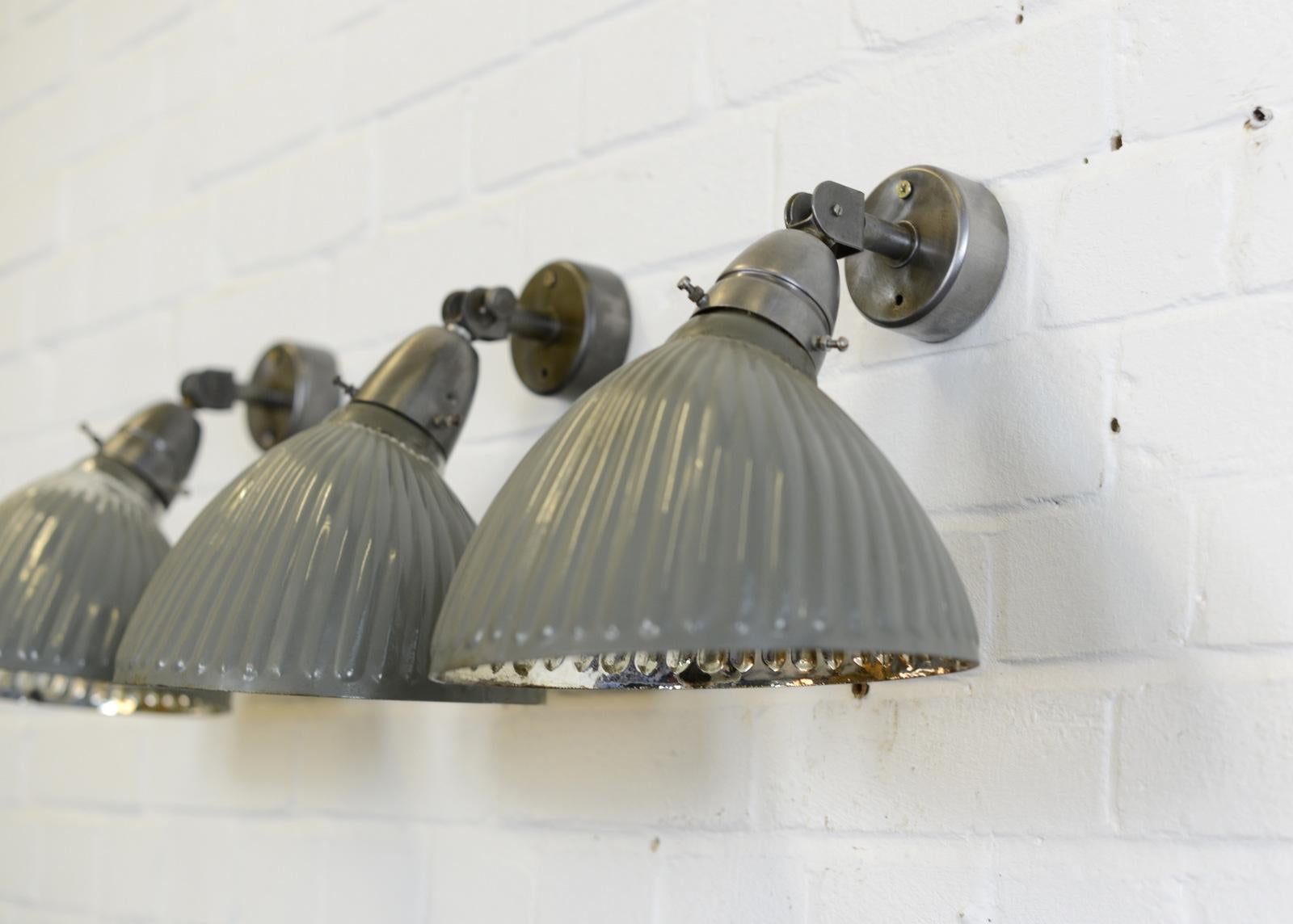 Wall-mounted light grey mercury glass lights, 1930s.

- Price is per light
- Original light grey outer paint
- Mercury glass inner reflectors
- Articulated arm
- Takes E27 fitting bulbs
- The lights wire directly into the wall
- Czech,