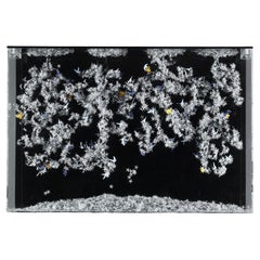 Wall-mounted metal and paper creation by Lebanese artist Nayla Tabet