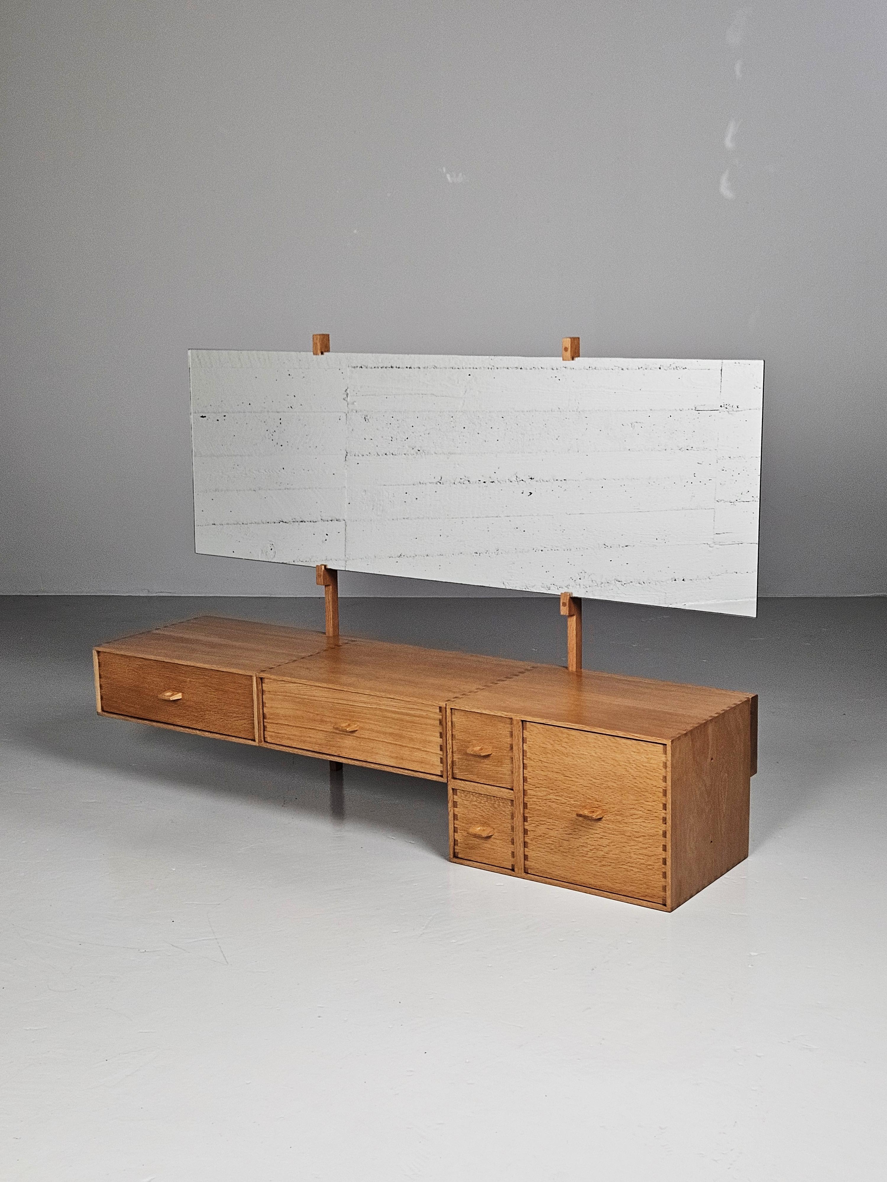 Beautiful Midcentury modern wall dressing table by Uno and Östen Kristiansson produced by Luxus Vittsjö, Sweden, during the 1960s. Made in oak with great details in the joinery, sculpted handles on the drawers.